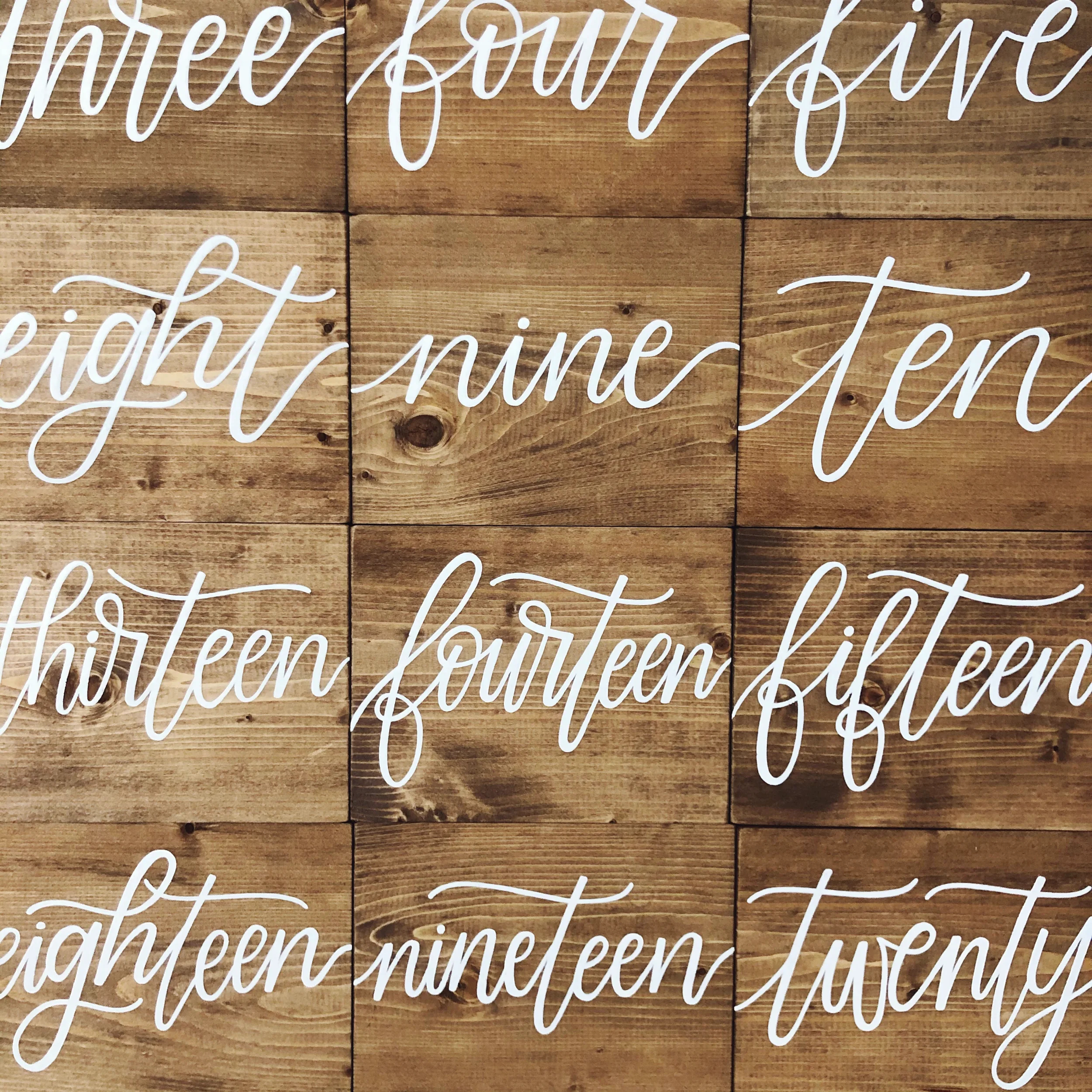 Hand-lettered wooden block table sign perfect for a casual wedding reception table.