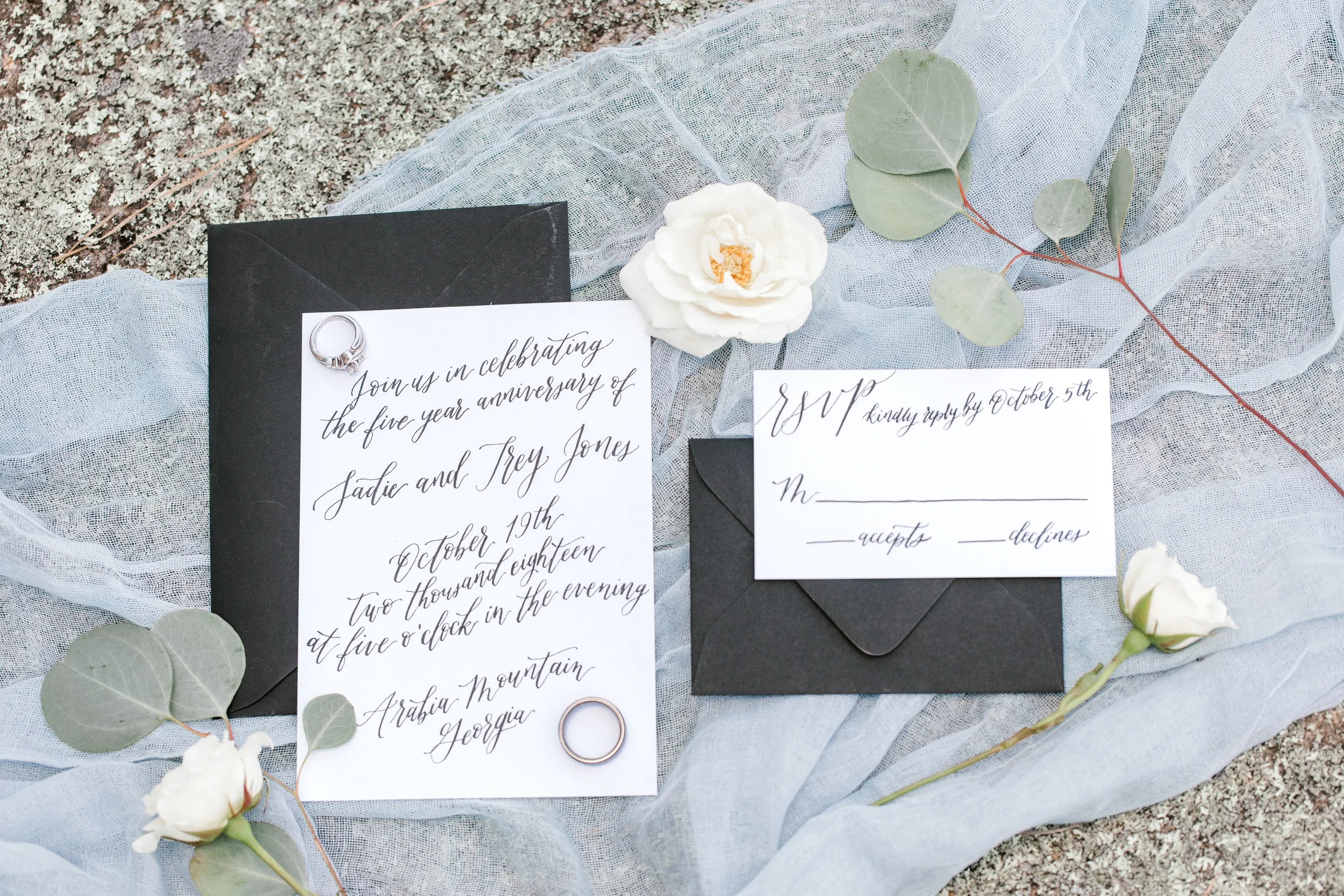 For milestones demanding absolute elegance, this formal black and white script invitation is a flawless fit. Relying entirely on stunning, fluid hand-lettered calligraphy on bright white cardstock, this minimalist approach pairs with a deep black env