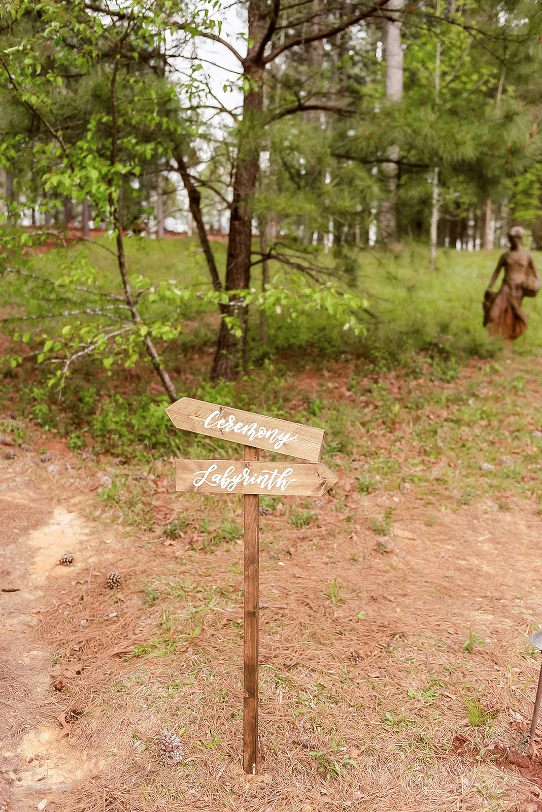 Direct your guests effortlessly across your event space with a rustic wooden directional signpost. Featuring hand-lettered arrows pointing to the ceremony, reception, and cocktail hour, this wooden wayfinding sign is ideal for outdoor, farm, or fores