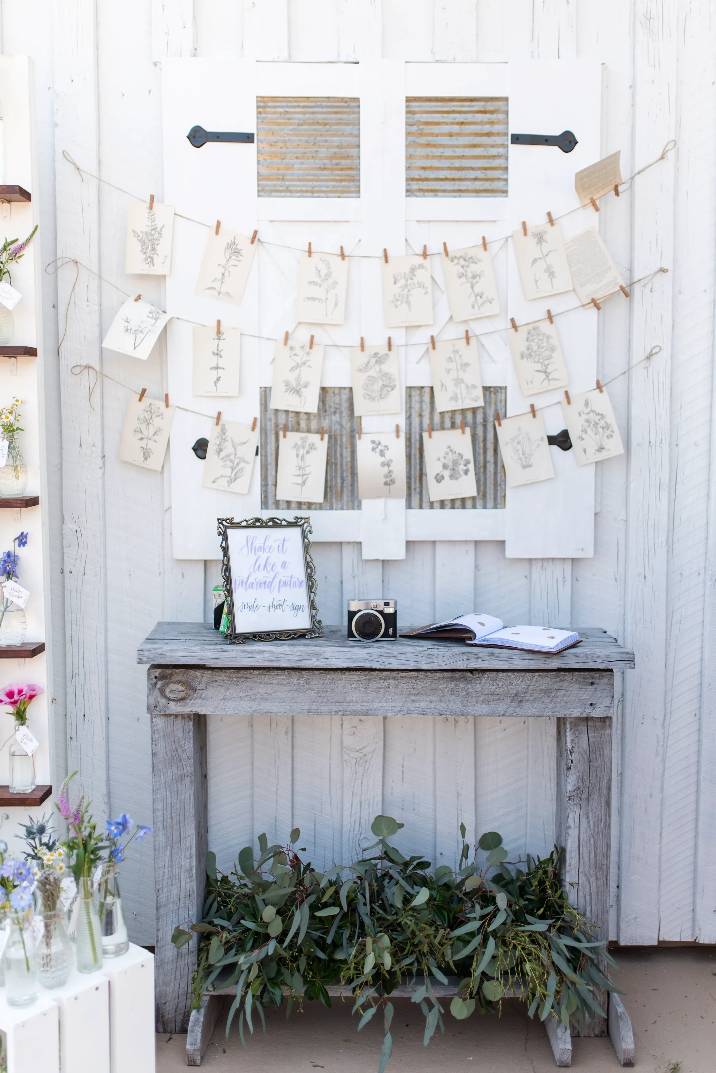 Hand-lettered watercolor polaroid photo guestbook sign in a vintage gold frame for an outdoor Georgia wedding.
