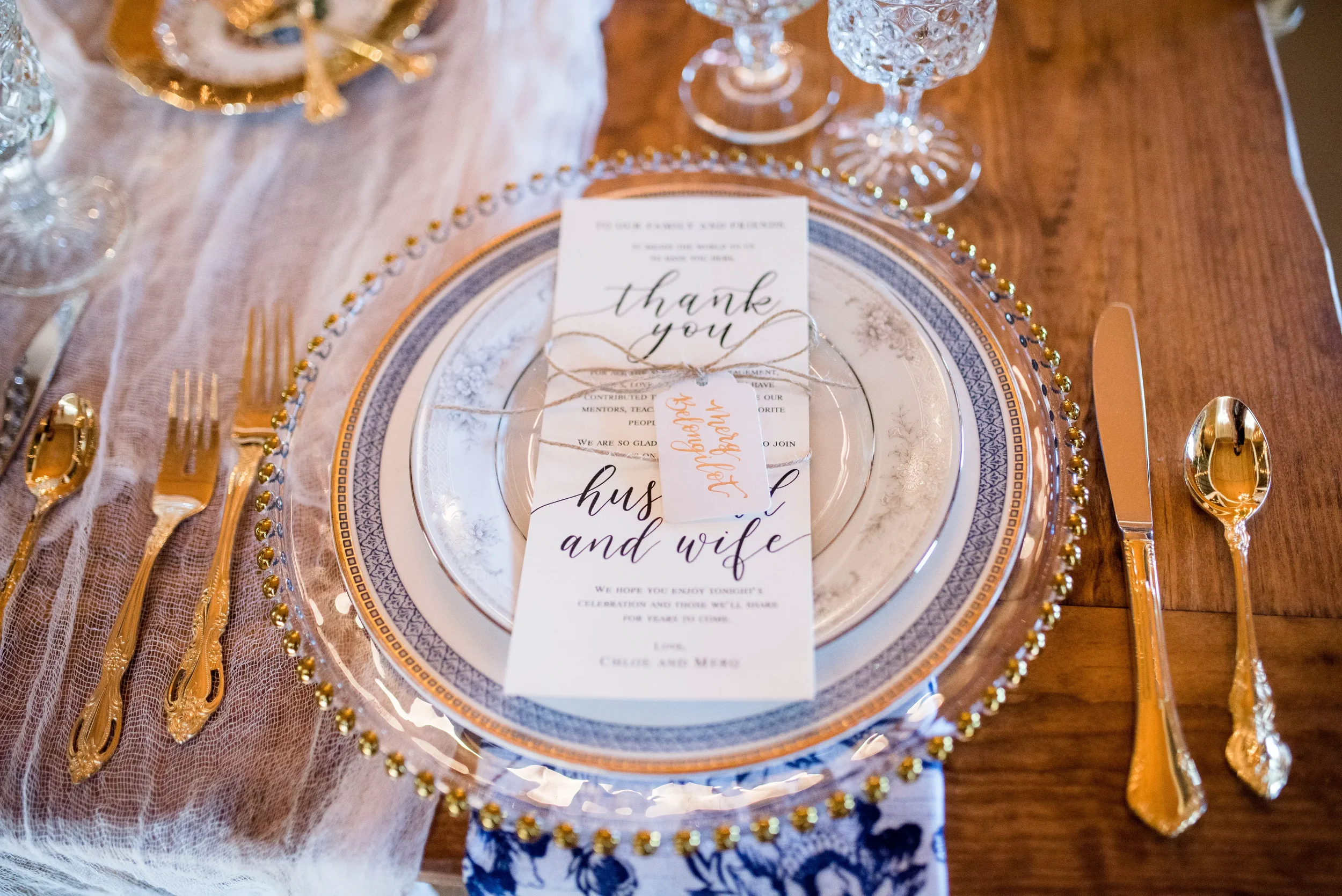 Infuse a sense of heirloom-quality elegance into your Georgia wedding day decor. Combining custom calligraphy place card tags, romantic typography, and antique-inspired floral porcelain, this fine art table styling setup sets a welcoming, luxurious t