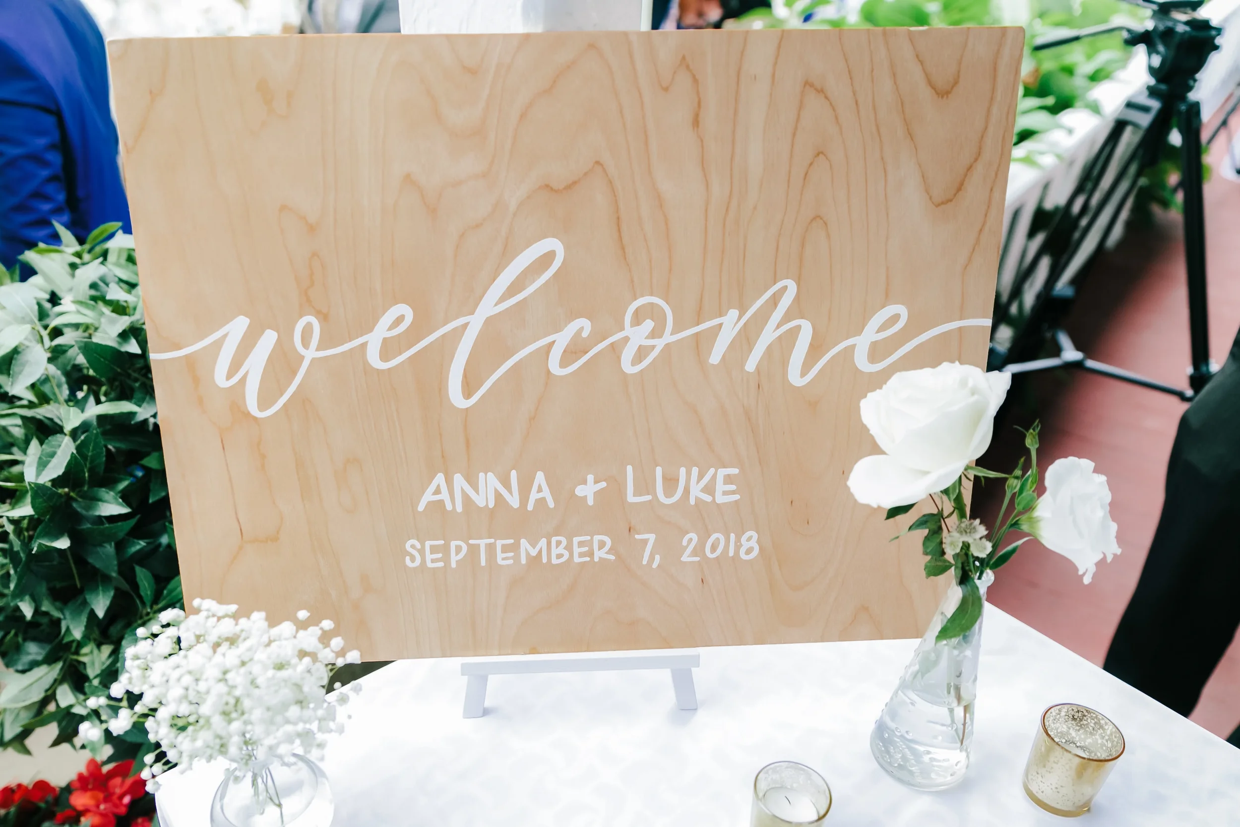 Handcrafted on natural wood with flowing white cursive and clean block lettering, this durable board features the couple's names and wedding date—making it a perfect keepsake for rustic, farm, or outdoor celebrations.
