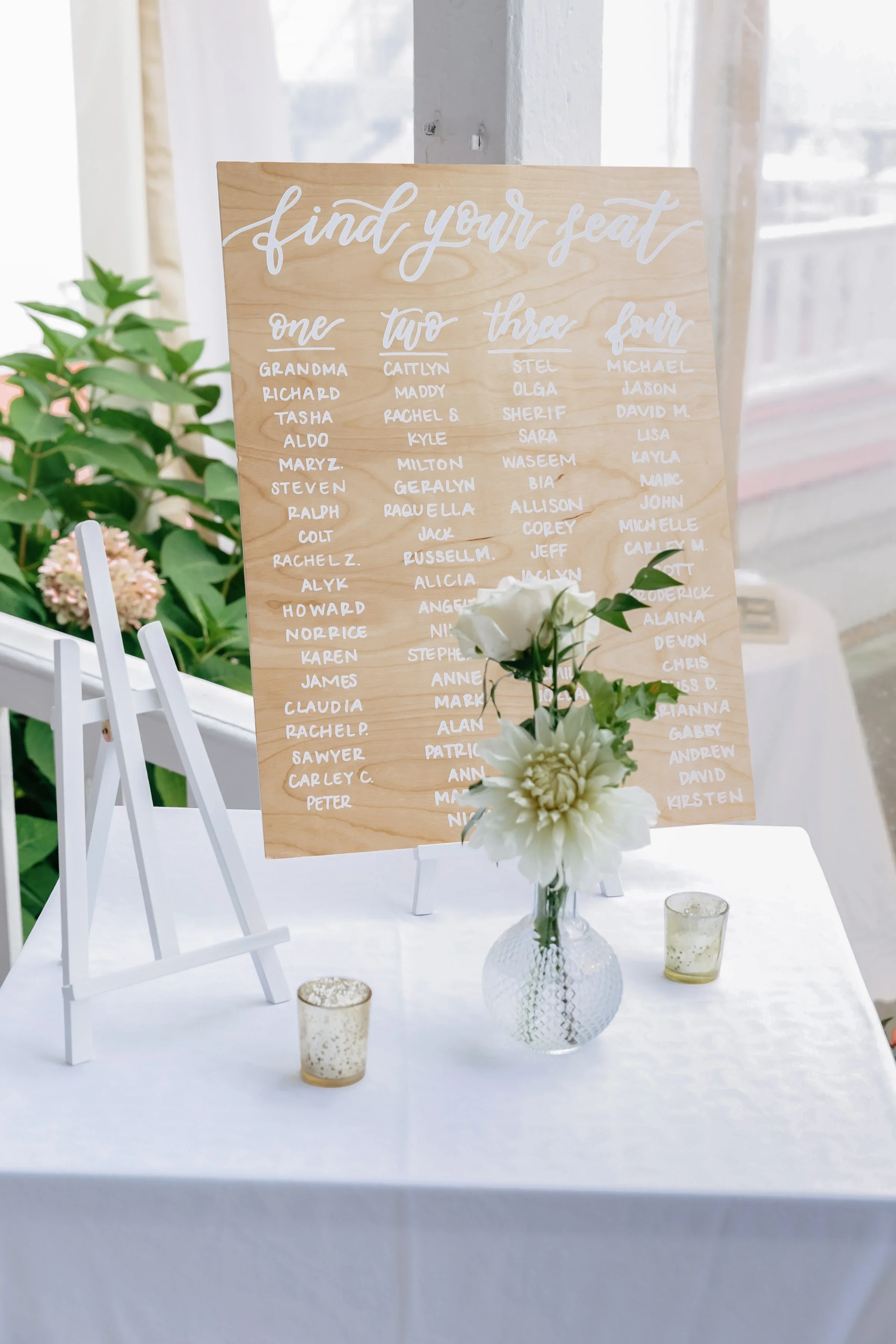 Guide your guests with organic charm using a natural wood "Find Your Seat" calligraphy chart. Hand-lettered in crisp white cursive script over warm wood grain, this minimalist seating board offers a clean, breezy aesthetic for garden, coastal, or out
