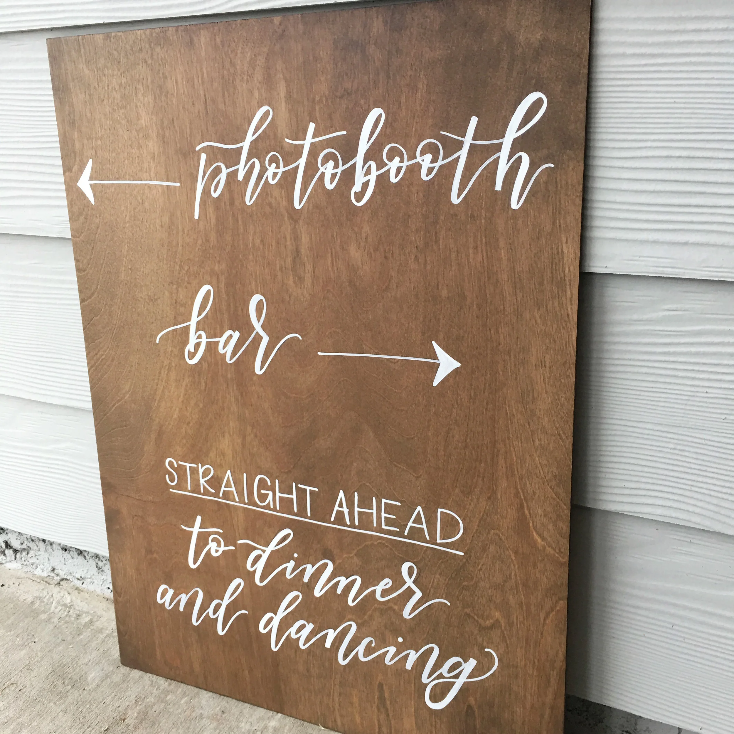 Guide guests smoothly through expansive venues with a custom directional wood sign.