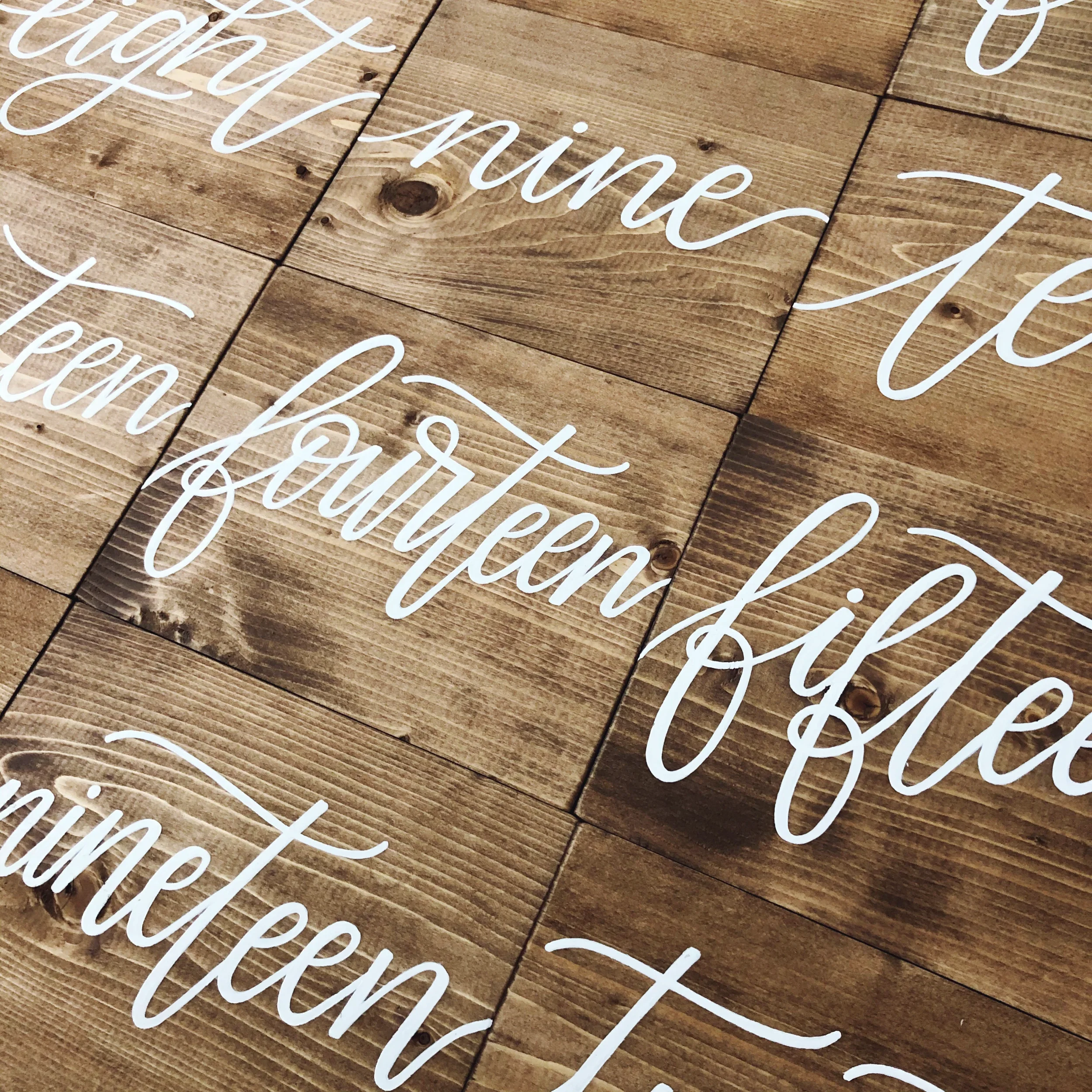 Hand-lettered wooden block table sign perfect for a casual wedding reception table.