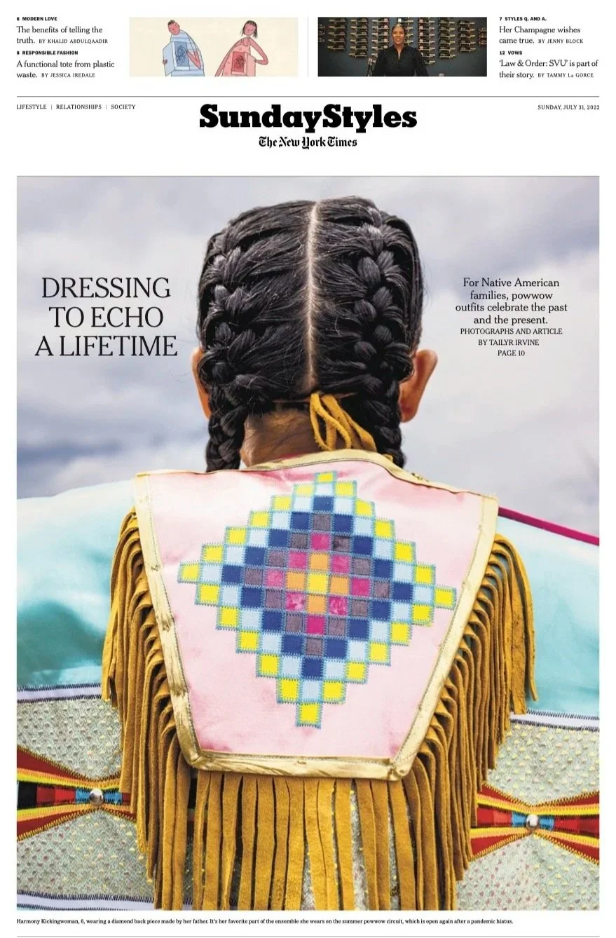 Front page of the Sunday Styles section of The New York Times, showing a woman from behind with long, braided hair wearing traditional Native American powwow attire, including a fringed garment with a diamond-shaped beaded design on the back.