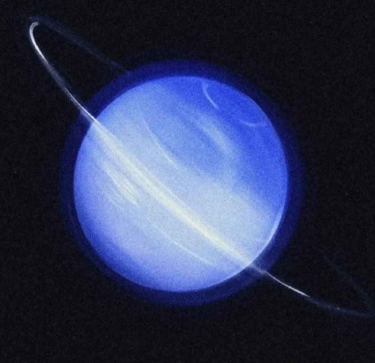 A photo of the planet Uranus, showing its blue-green color with faint rings around it in space.