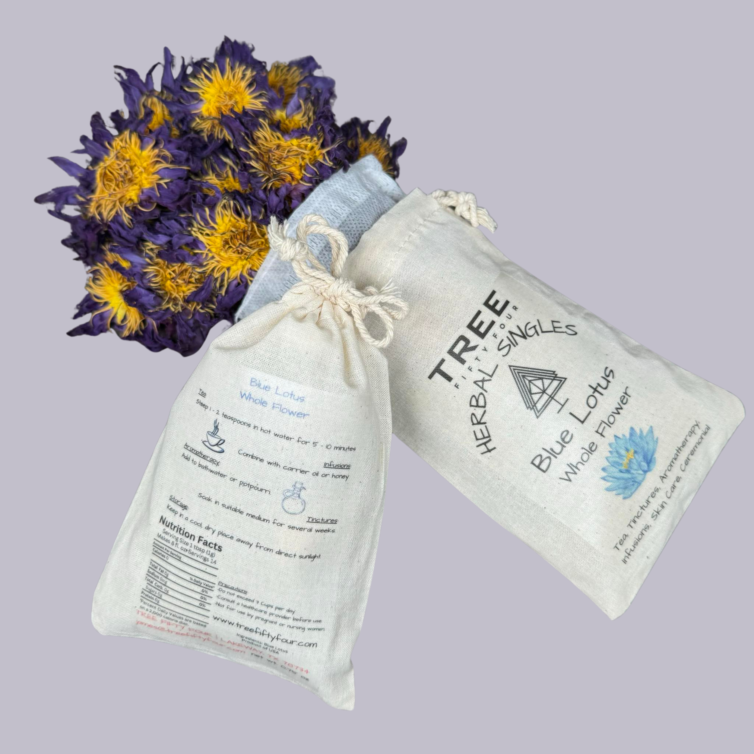 Bundle of dried purple and yellow flowers wrapped in a white cloth bag with black text, set against a light gray background.