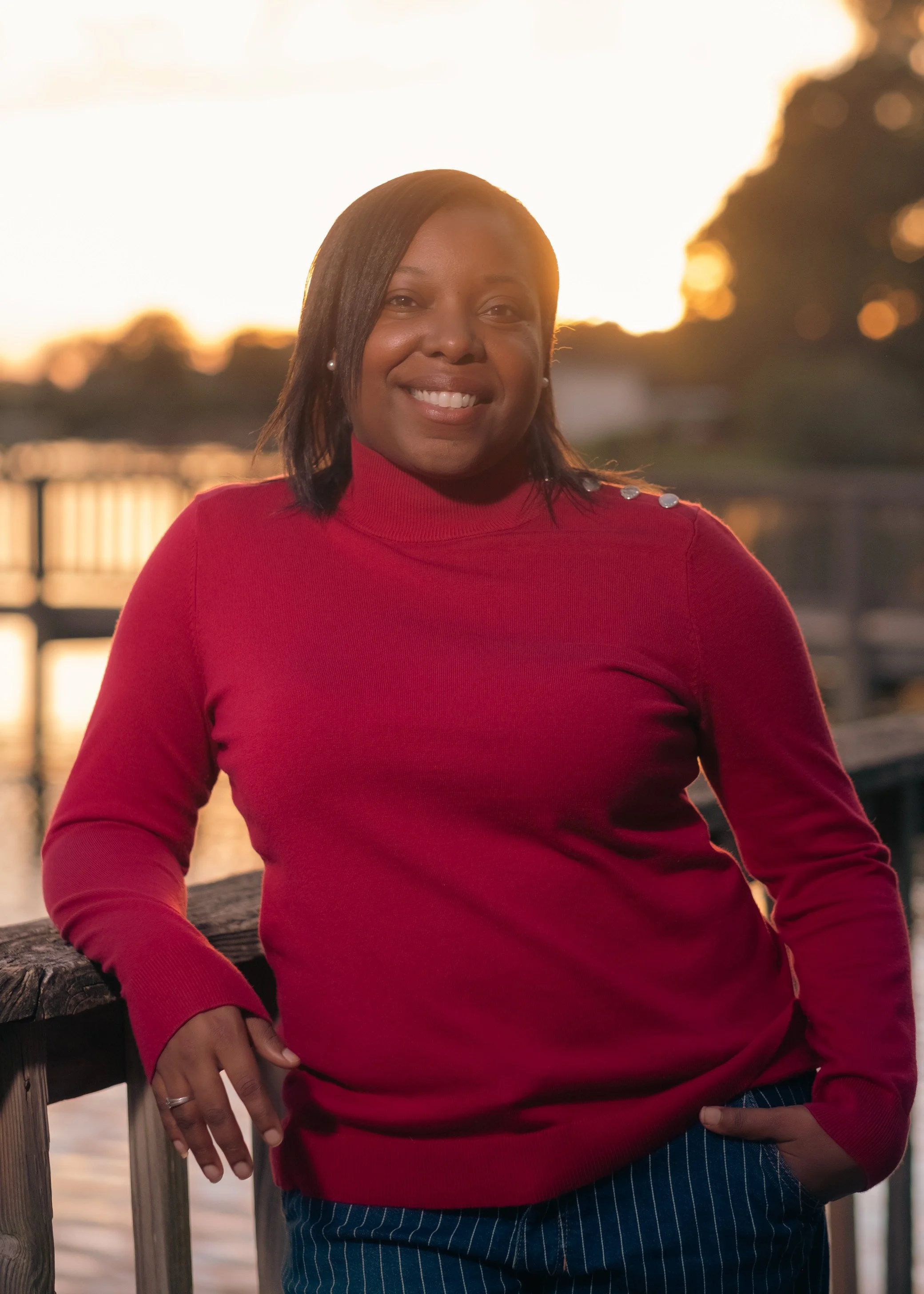 woman red shirt sunset waterfront