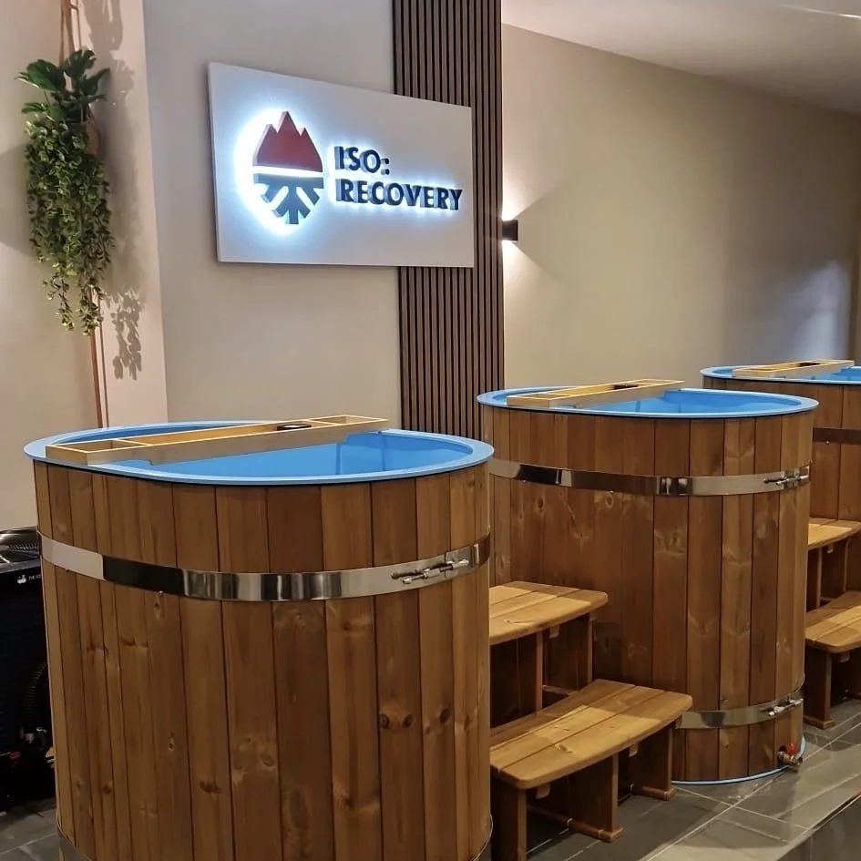 Brand identity design for cold plunge and sauna business ISO: Recovery. Logo on sign above cold plunge baths at premises