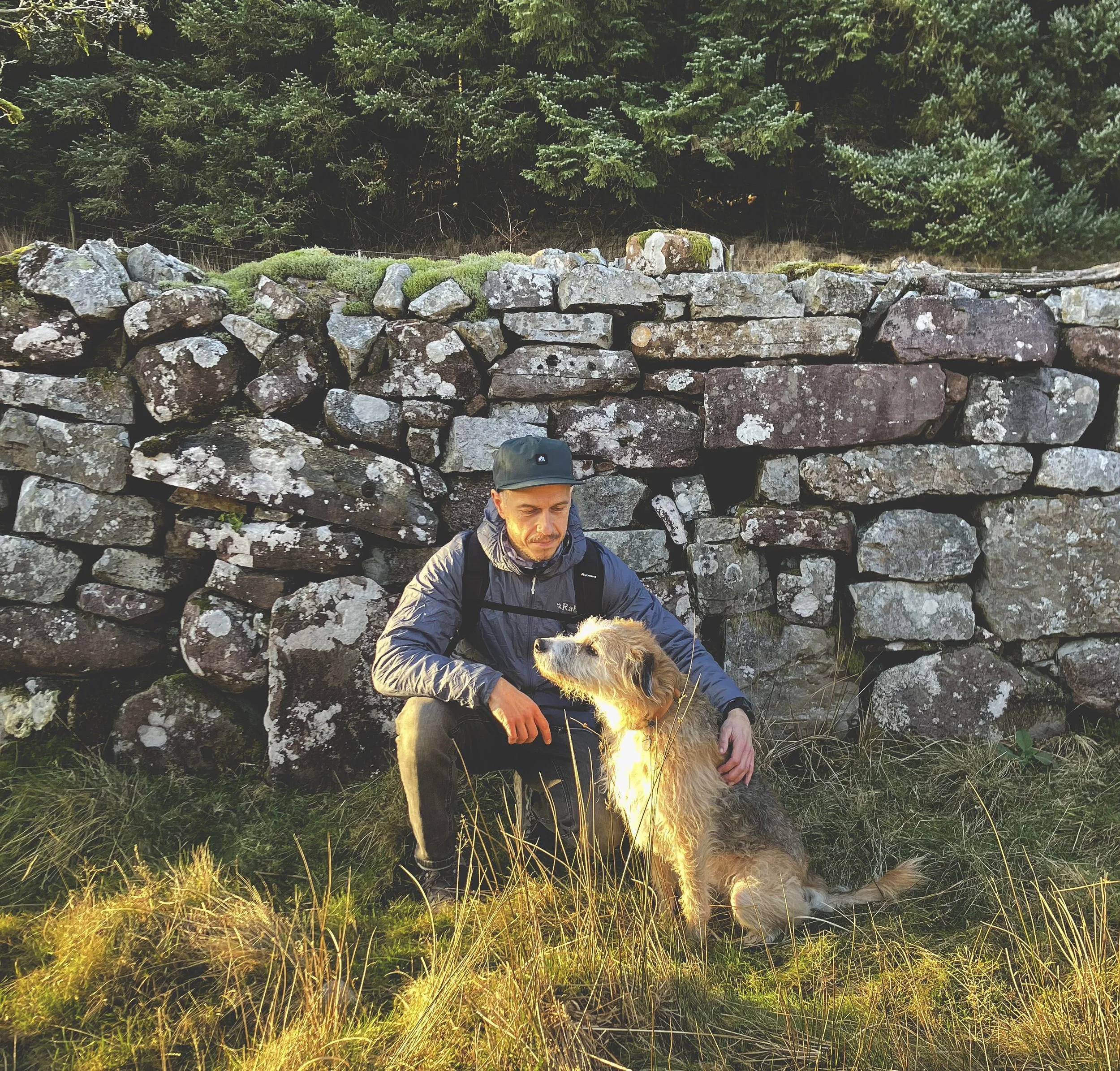 Image of Rhys and his dog enjoying the outdoors