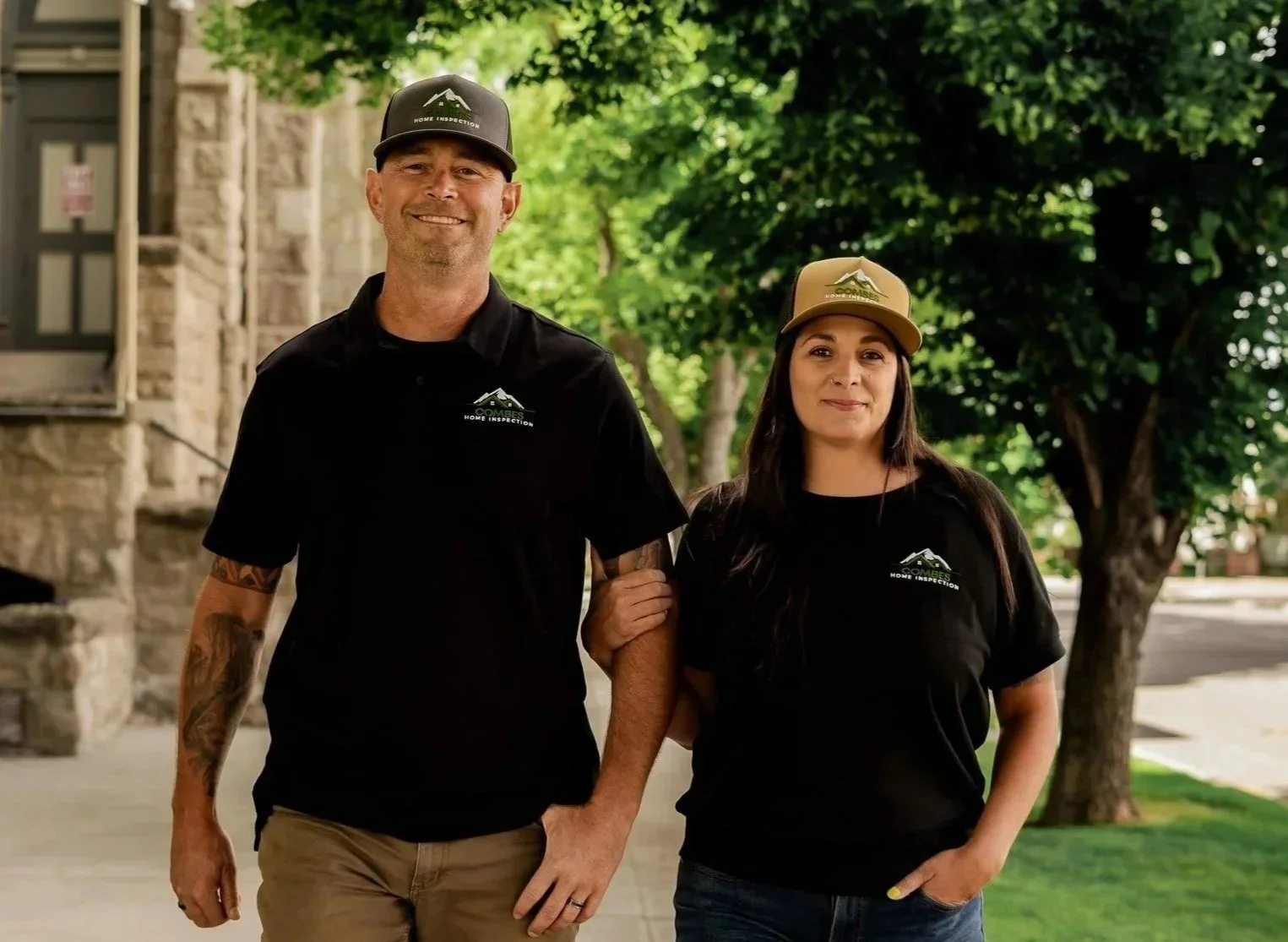 April and Sebastian Combes wear home inspection hats and walk in downtown Baker City, Oregon.