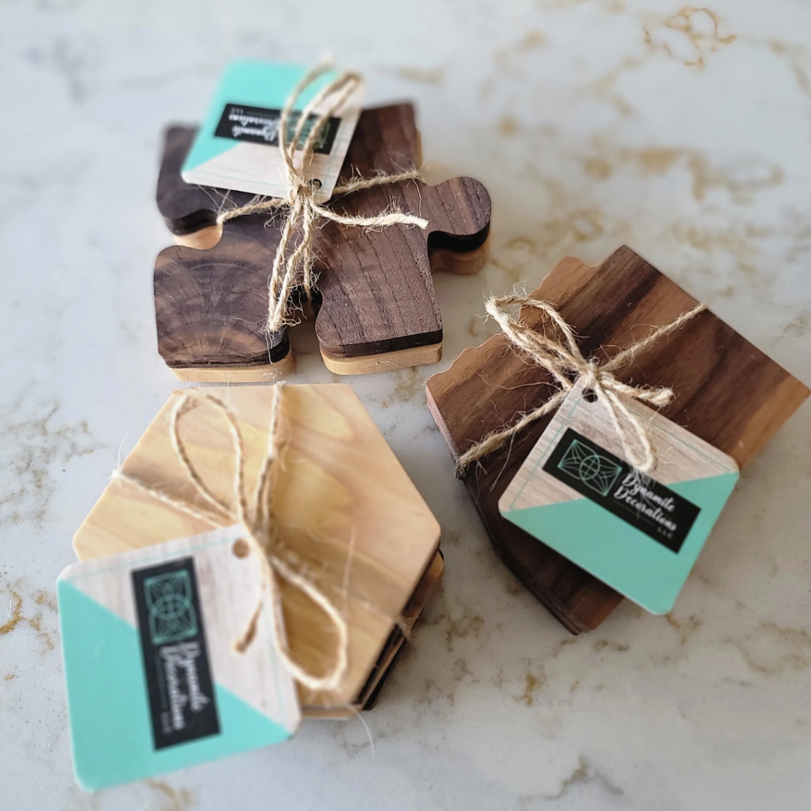 Sets of small wooden cutting boards tied with twine, labeled with 