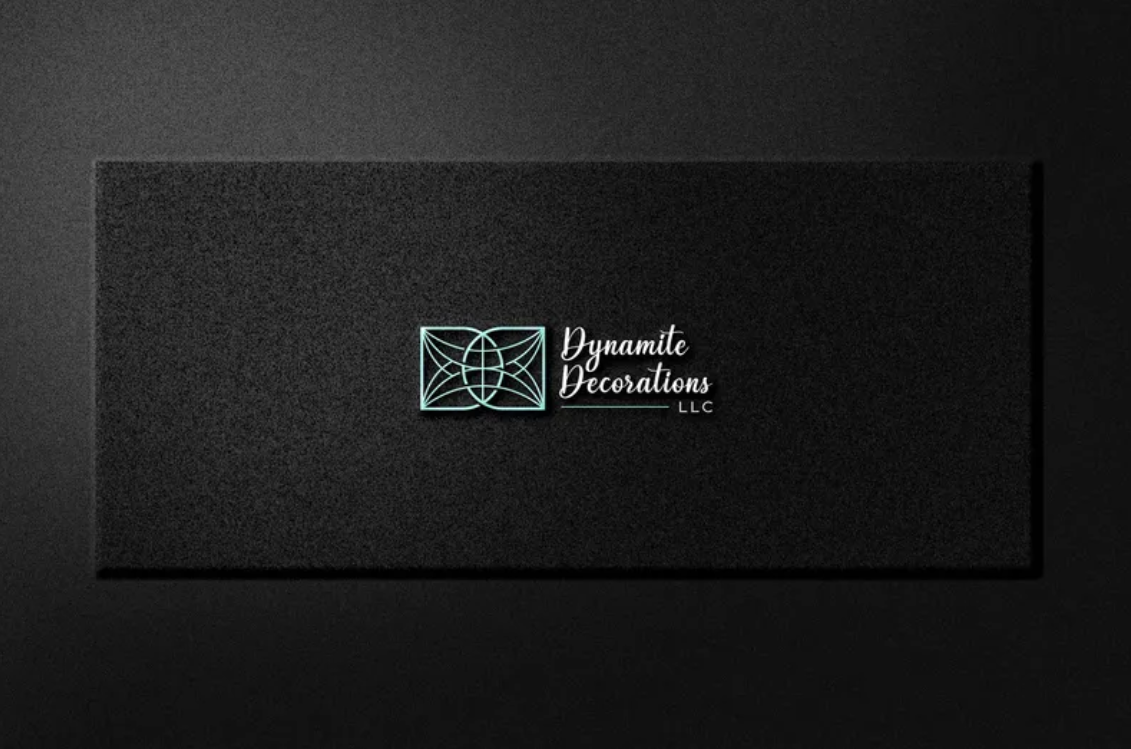 Dark rectangular sign with a neon-like geometric logo and the text 'Dynamite Decorations LLC' in cursive.