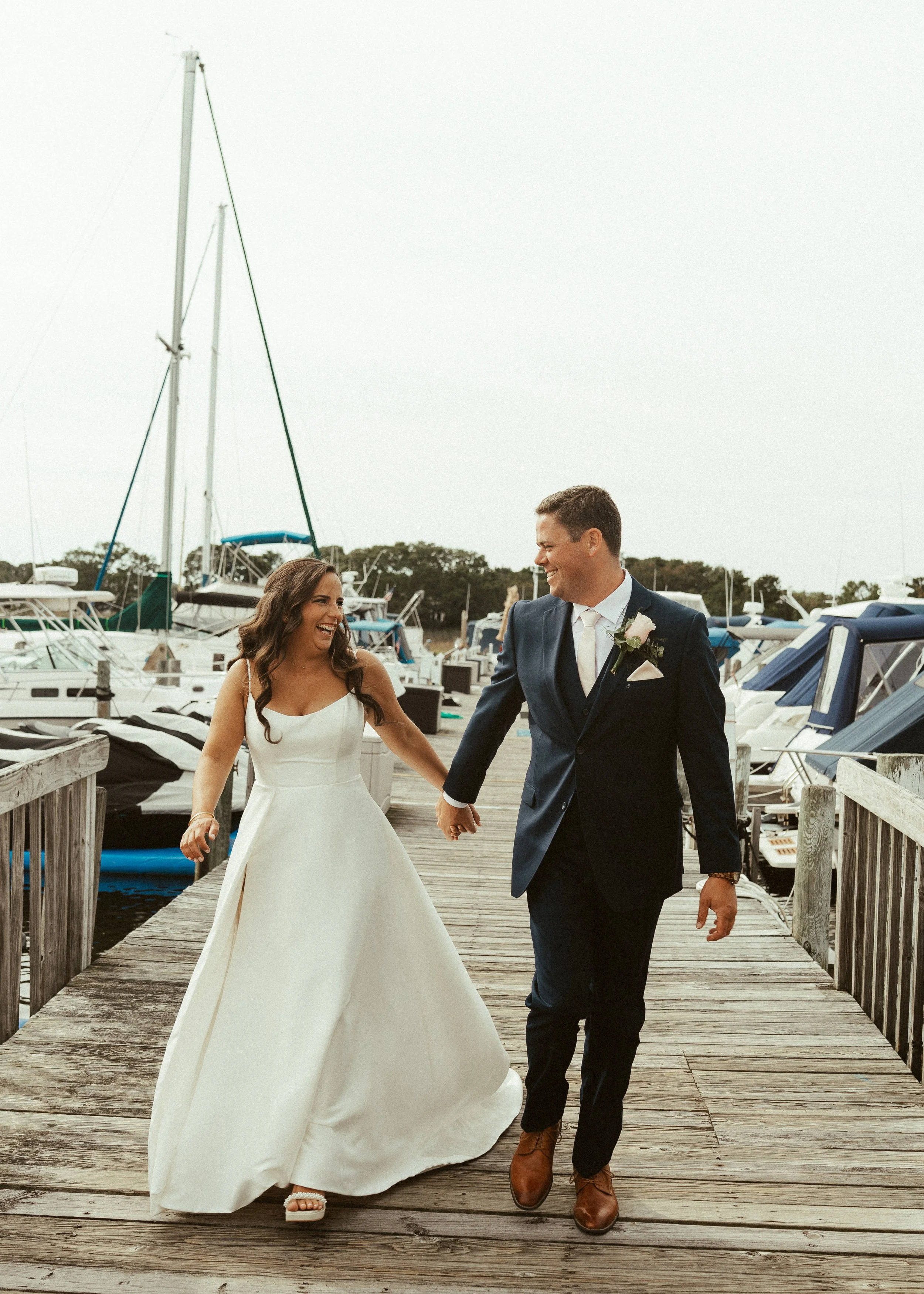 Professional makeup artist creating timeless beauty for a luxury waterfront wedding.