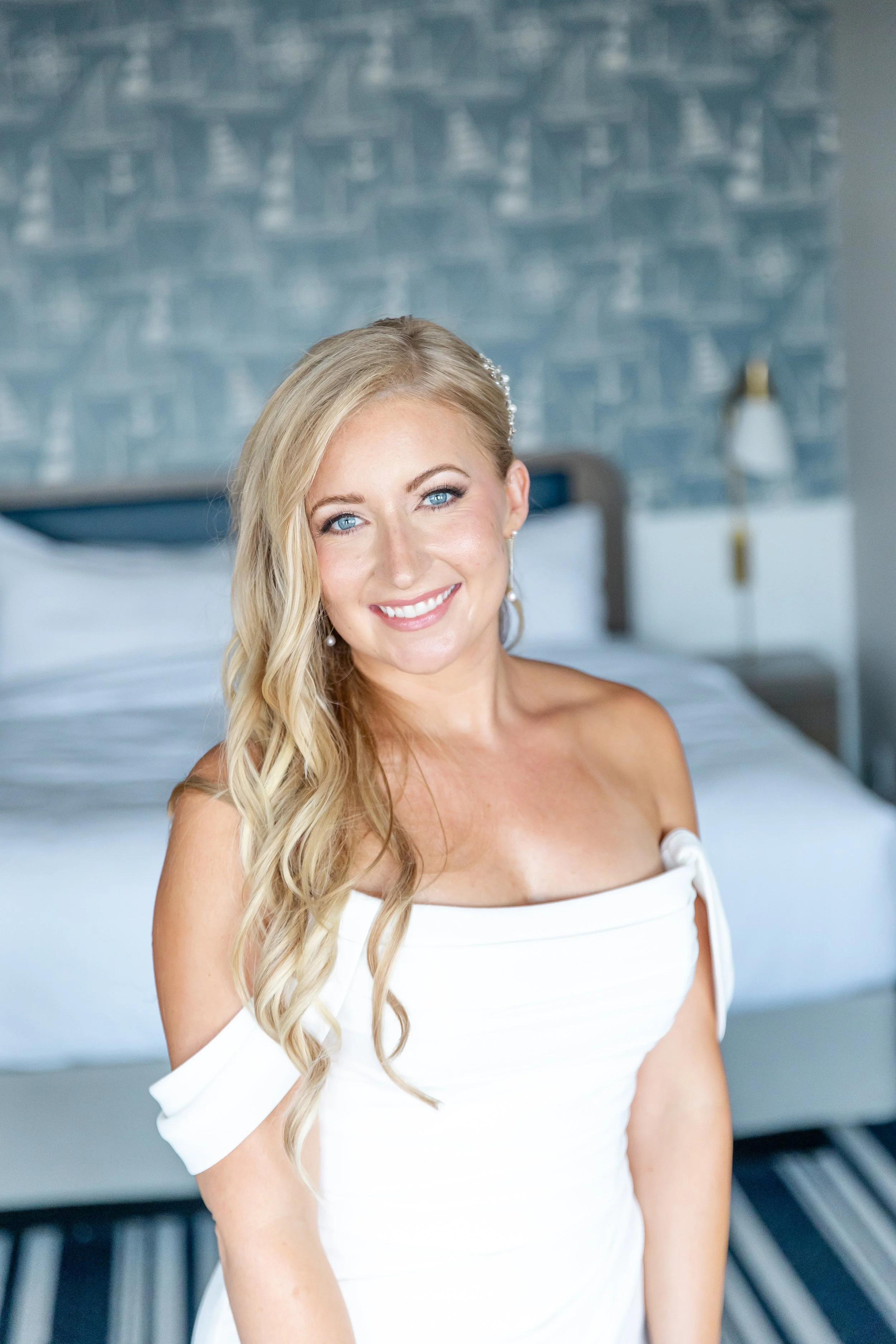 Professional makeup artist creating timeless beauty for a luxury waterfront wedding.