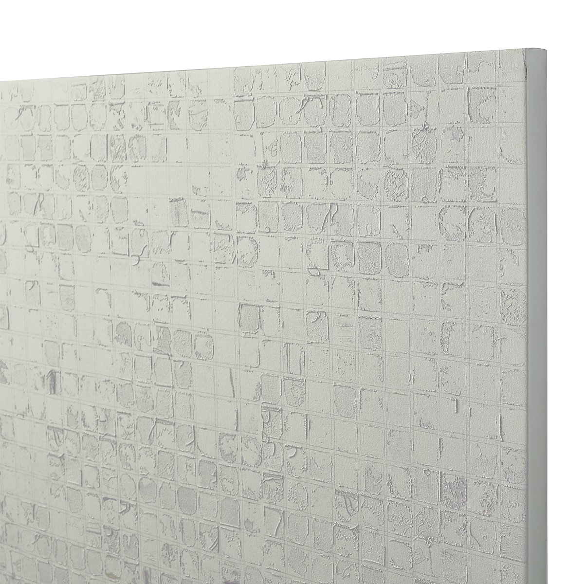 Close-up of a textured art replica with a grid pattern and raised brick-like details.
