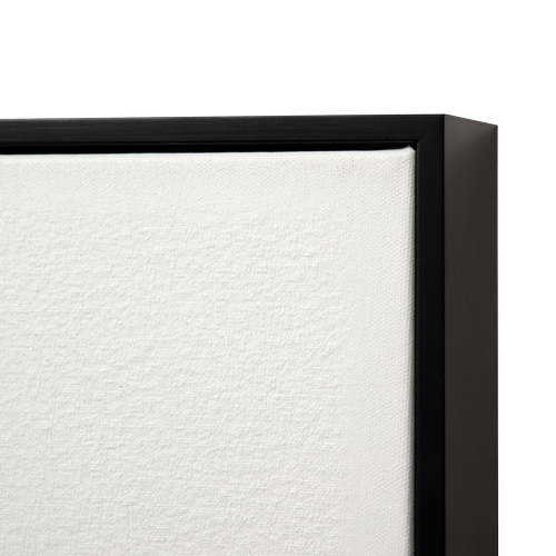 Close-up of a black float frame around a white canvas or poster.