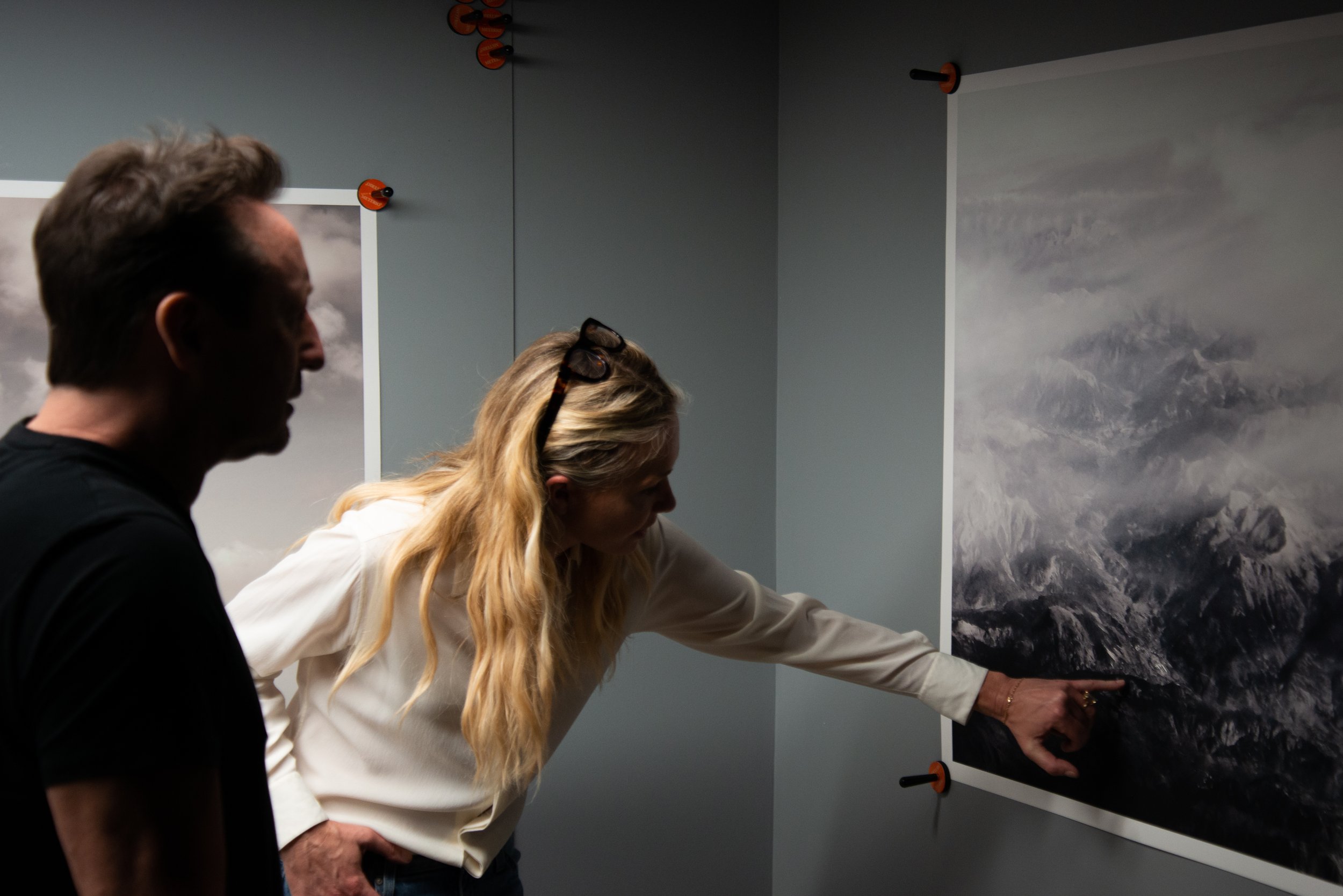 Artist and Portia de Rossi reviewing printed art replicas at General Public HQ. 