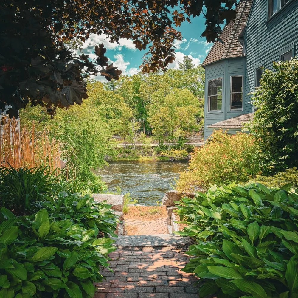 A garden path overlooking the Contoocook River near The Living Room in Henniker, NH