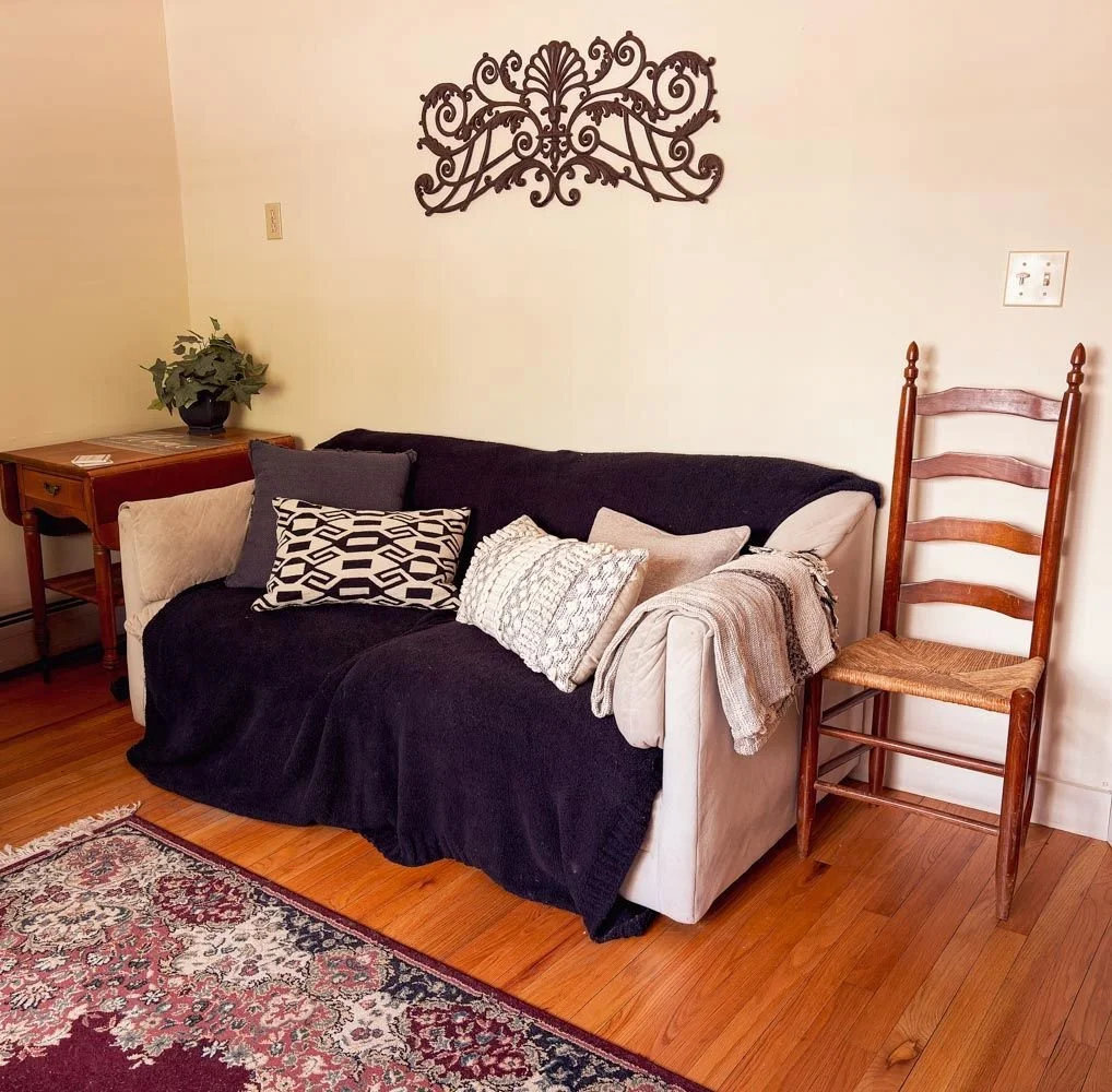 The Community Room at The Living Room, a gathering space with couch and seating