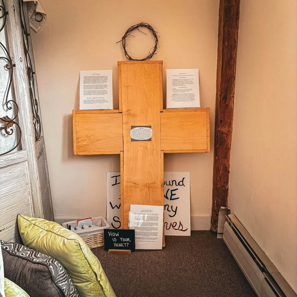 A kneeling prayer station in the Quiet Room, an example of prayer room design by The Living Room