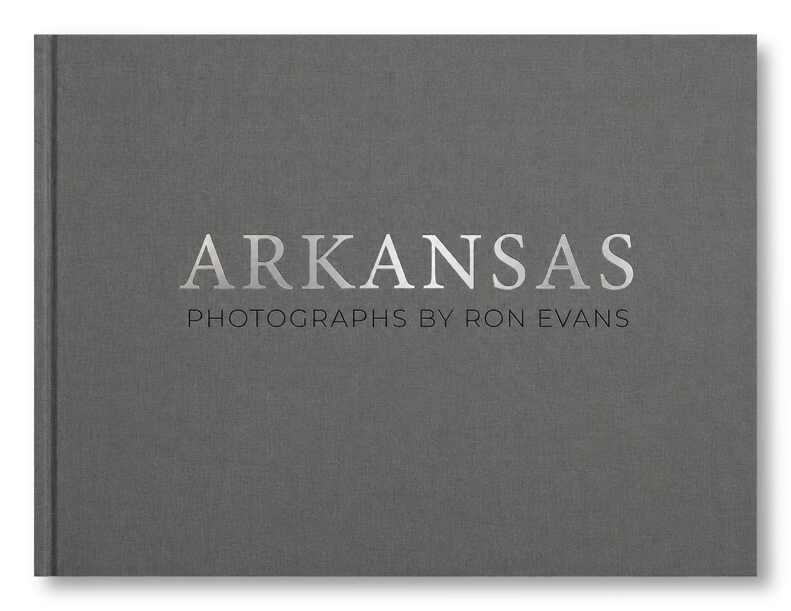 Gray book cover with text reading "Arkansas Photographs by Ron Evans" in silver and black lettering.