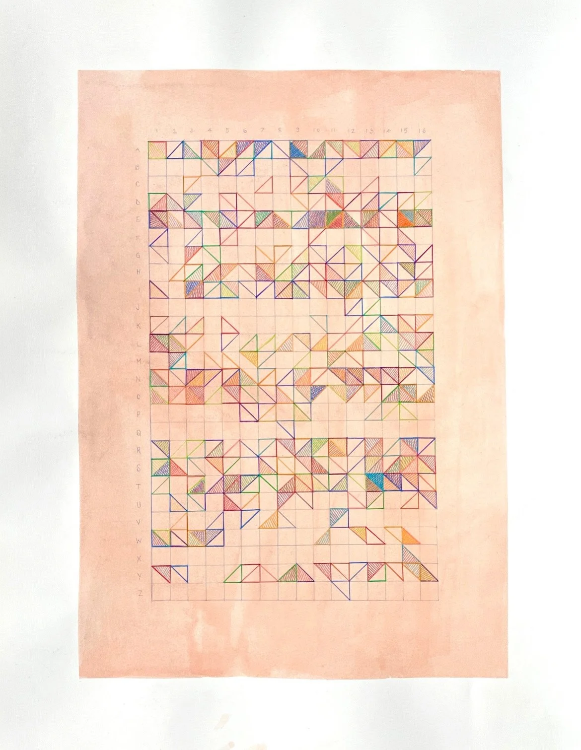 A grid chart with rows labeled A through Z and columns numbered 1 through 16, containing numerous small, colored geometric shapes, primarily triangles, in various colors and patterns, on a pink background.