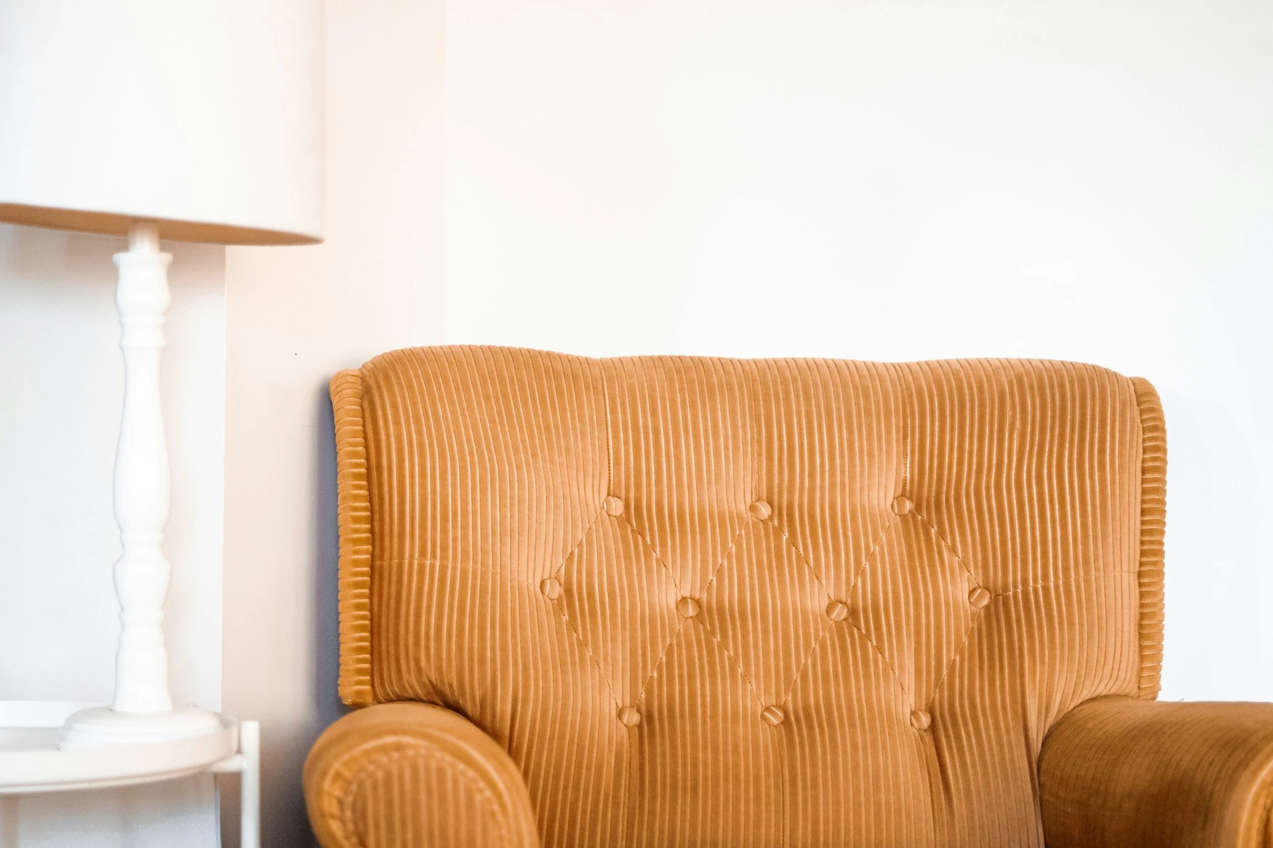 Gold corduroy chair in the office of a couples therapist in Nova Scotia