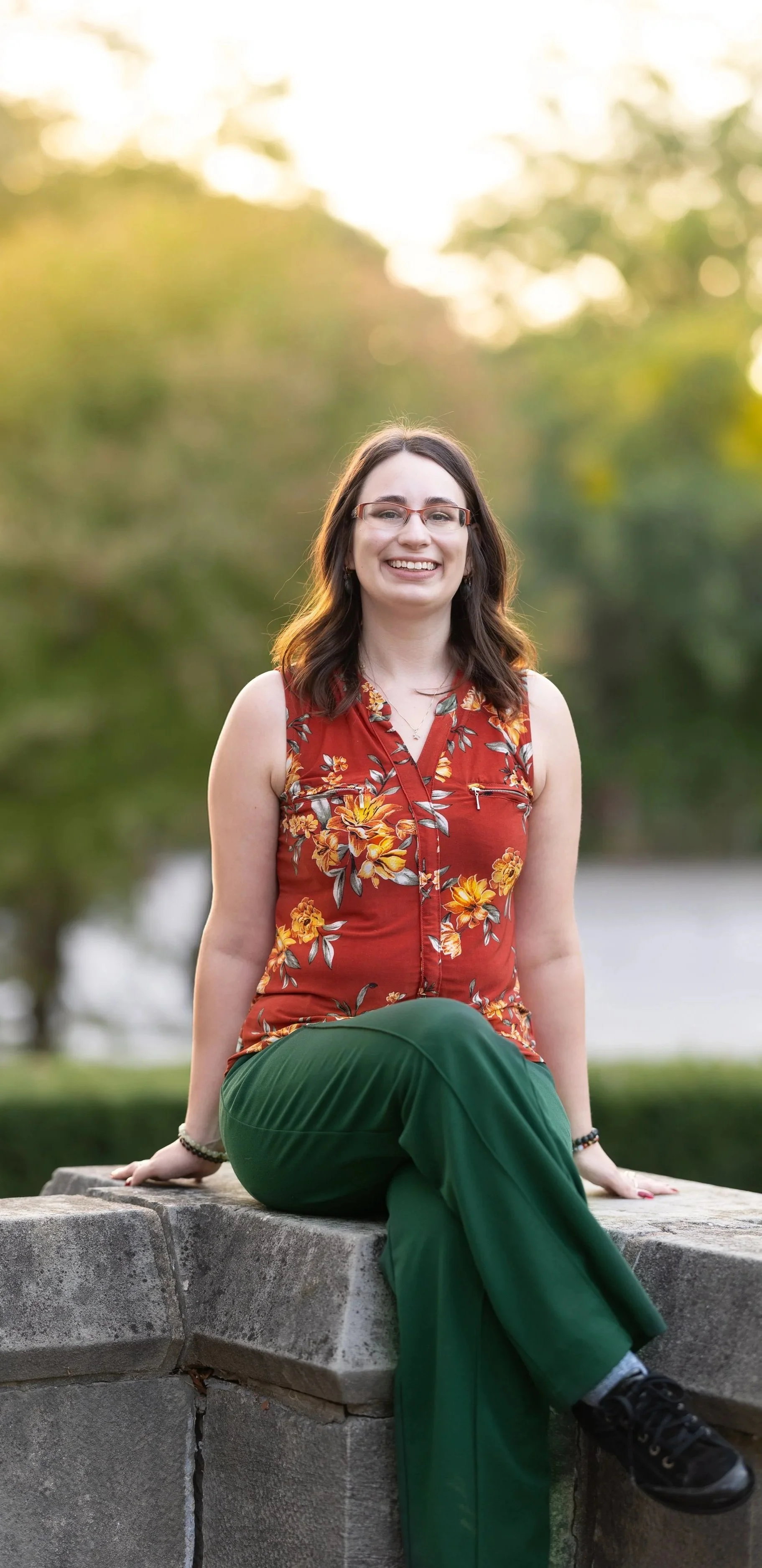A female anger management therapist in Ontario outside wearing a floral shirt