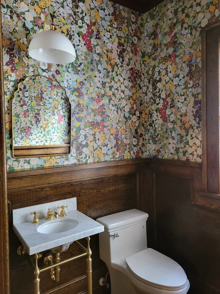 Historic Druid Hills powder room with wall paneling.