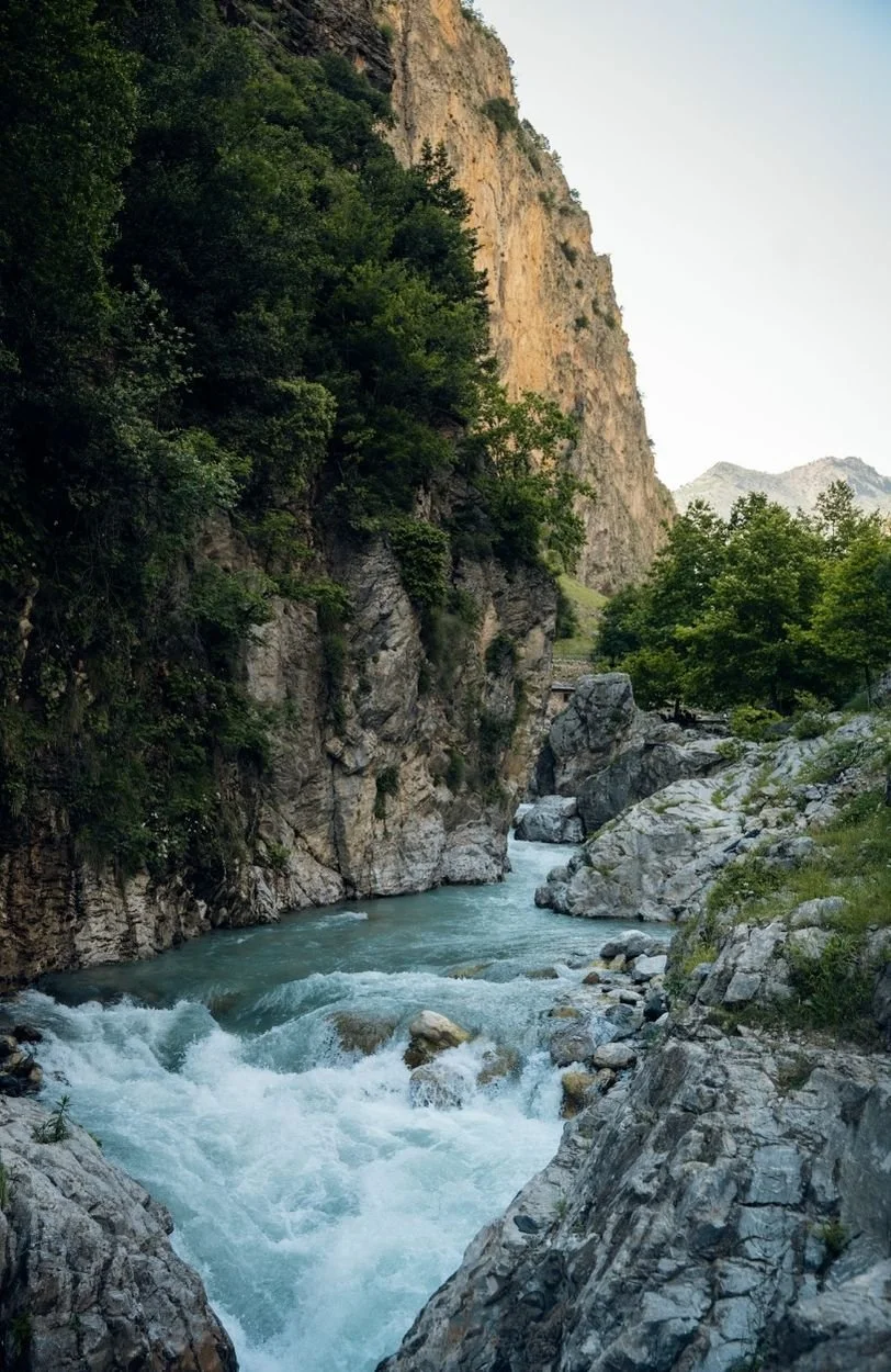 a river at the base of a mountain