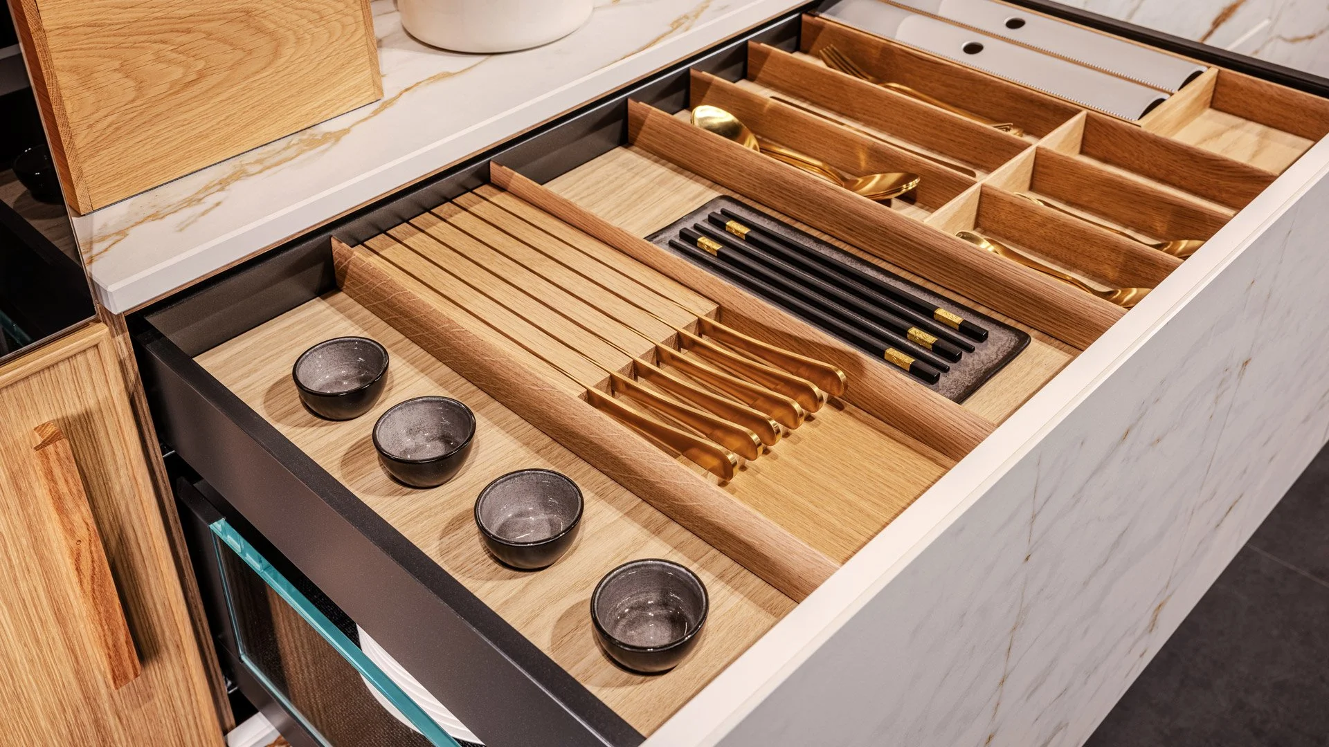 Luxury cutlery try by Sachsenküchen and Hettich. Premium kitchens. Wooden cutlery tray insert.