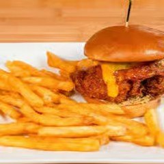 Cheeseburger with fries on a white plate