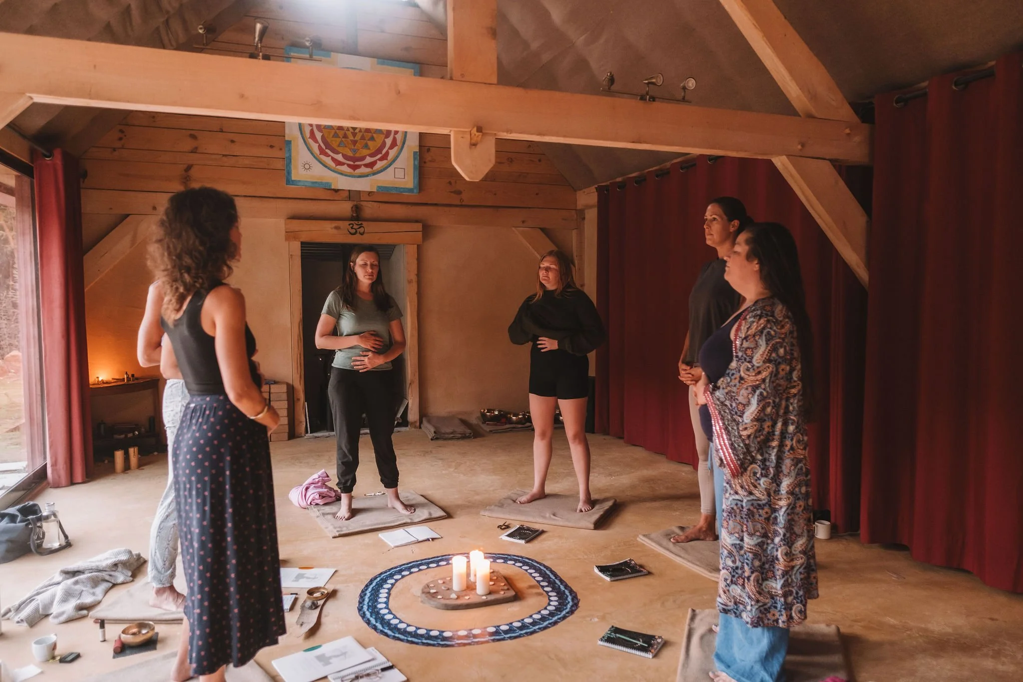 Women gathered in circle for reflection and connection.