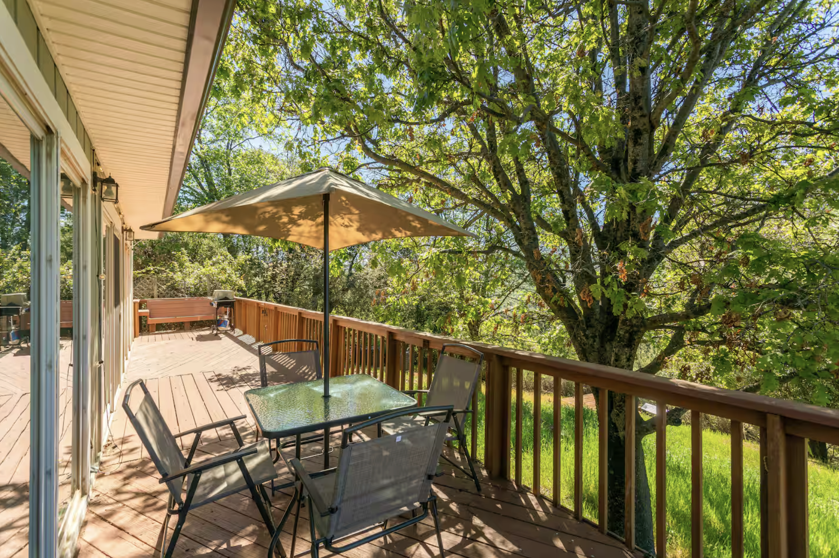 Wooden deck overlooking the woods at retreat venue.