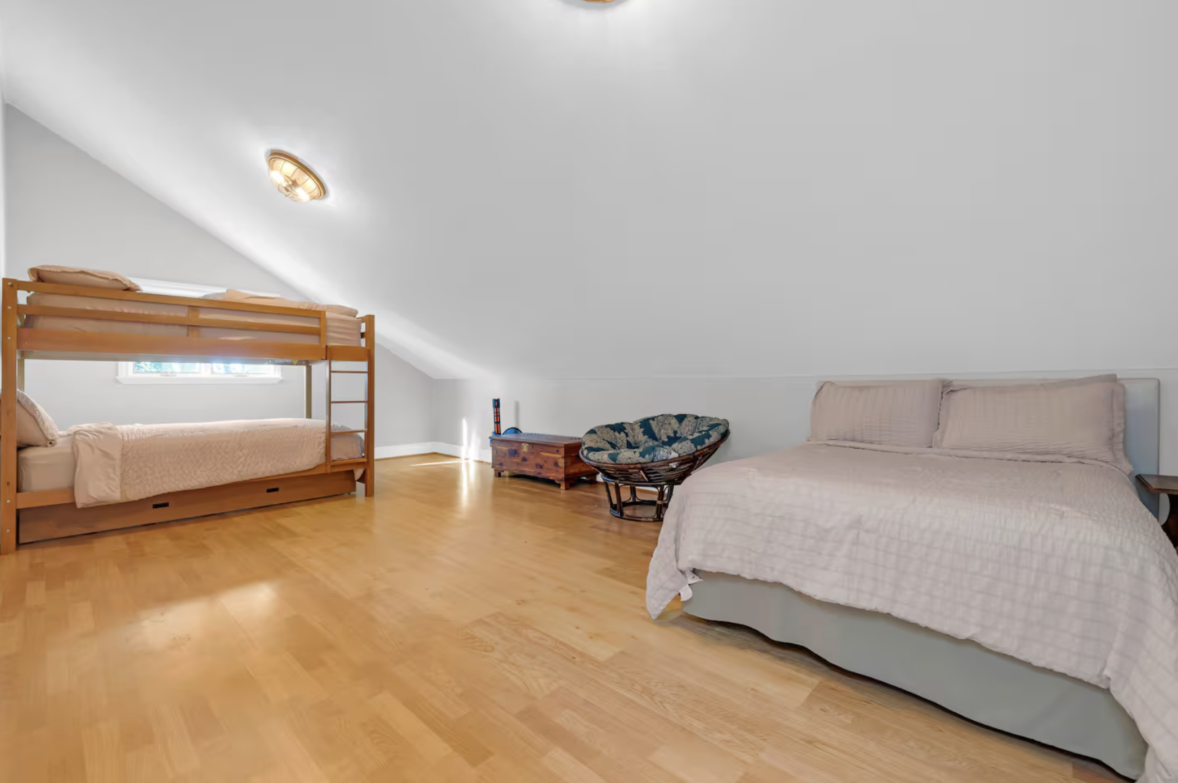 Shared retreat bedroom with full bed and queen bunk beds.