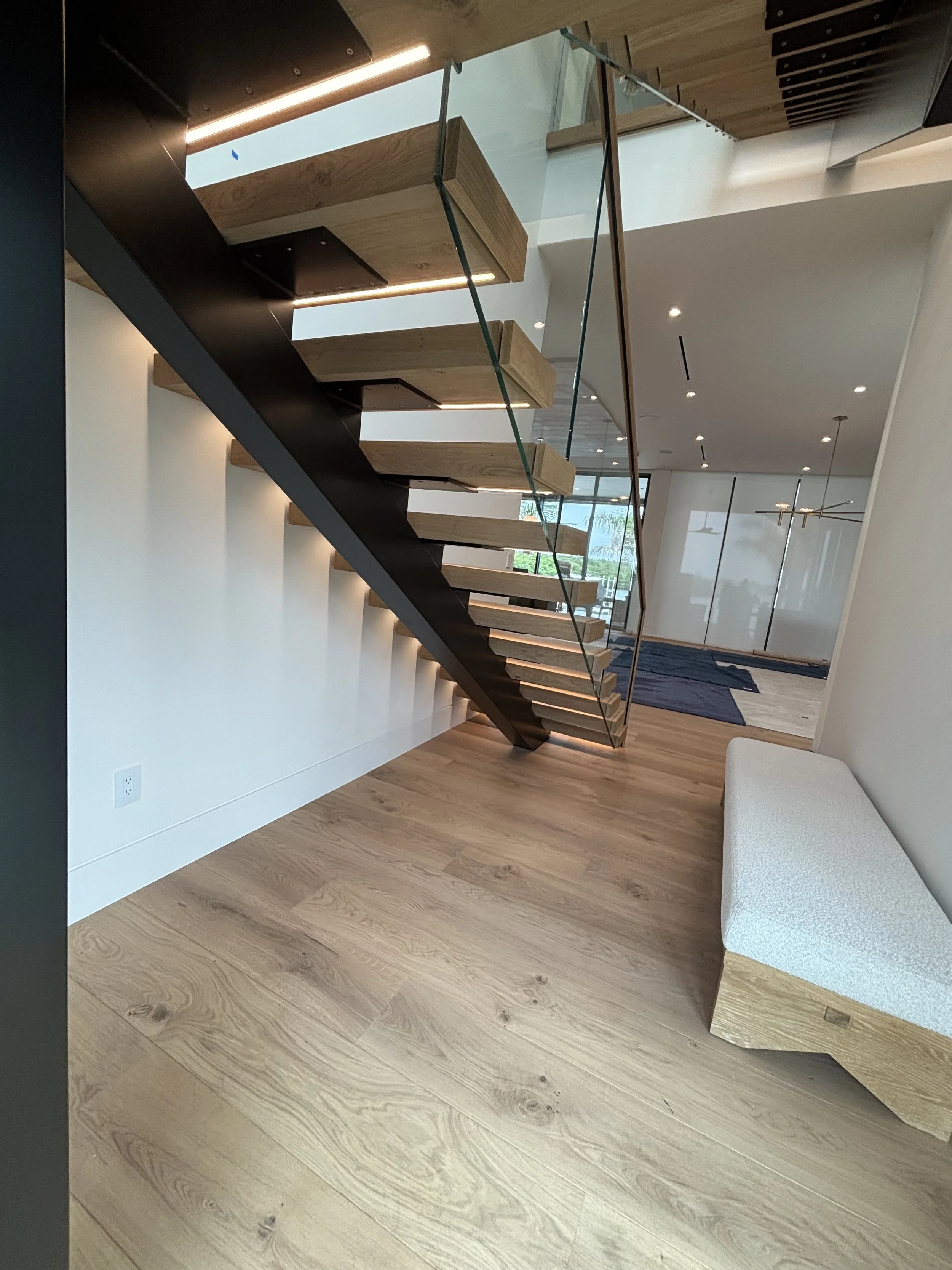 led-lights-floating-stairs-glass-railing.jpeg