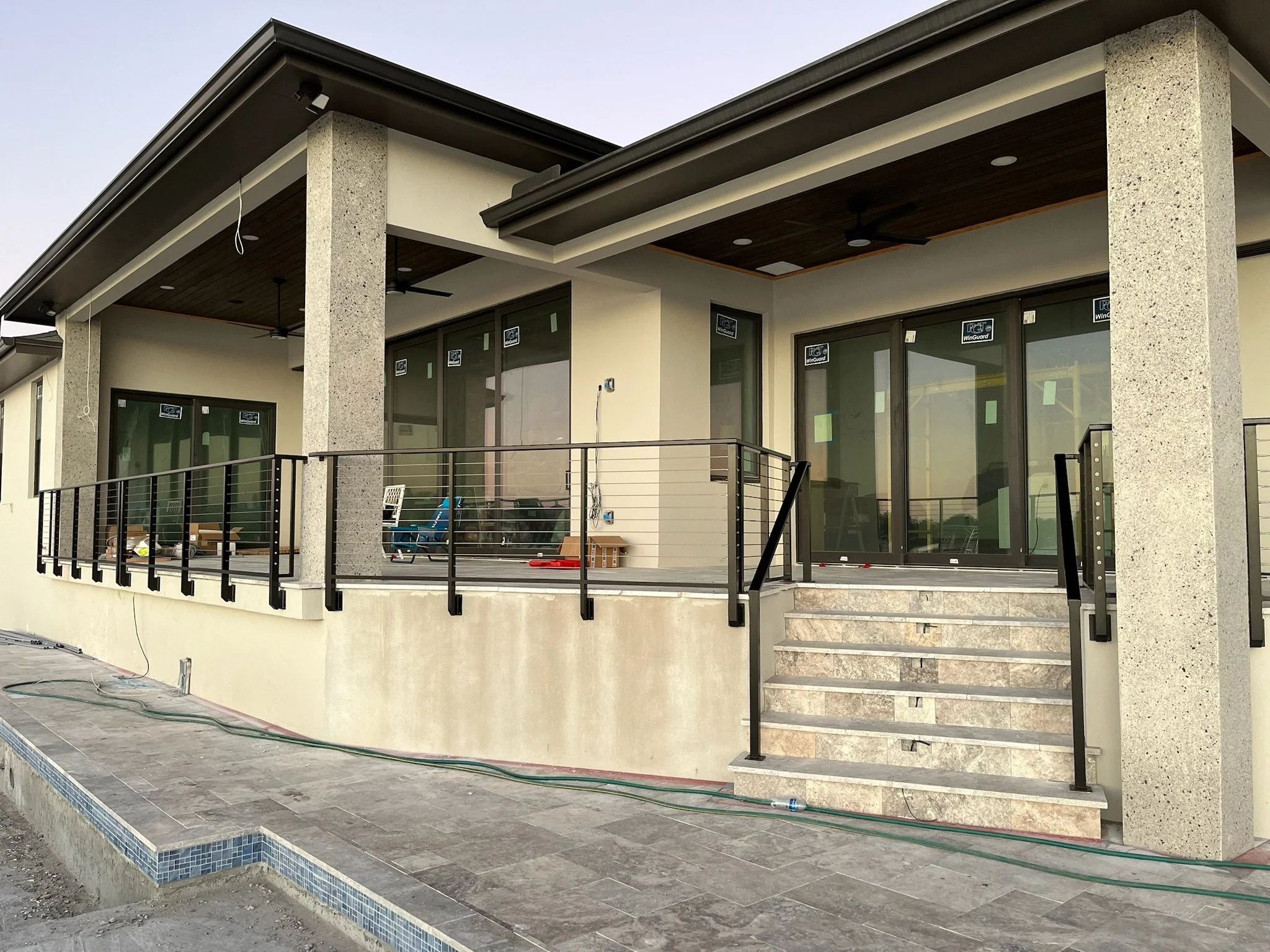 Custom aluminum railings Sarasota luxury waterfront home under construction