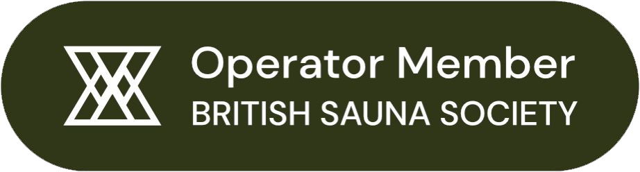 An olive green badge with white text that reads "Operator Member British Sauna Society" alongside a stylized sauna symbol.