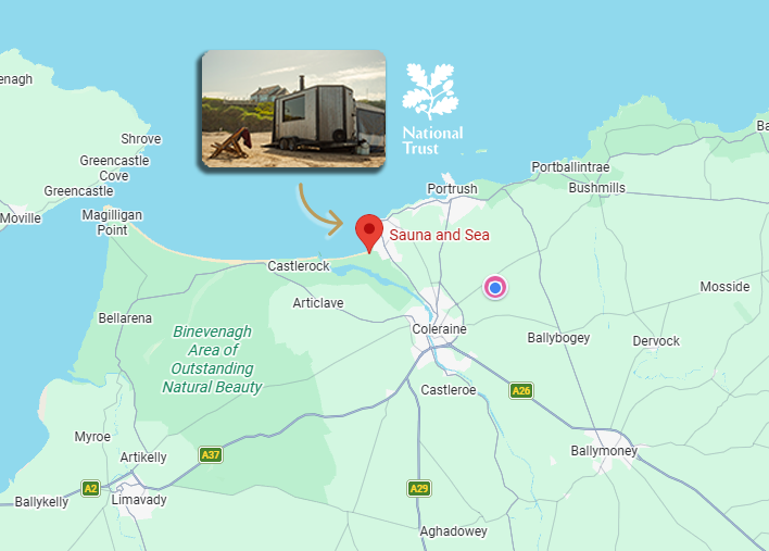 Map of the Coleraine area in northern Ireland with a pin indicating Sauna and Sea on its north coast, and an inset photo of a mobile sauna trailer on a beach. Showcasing its location on the map.
