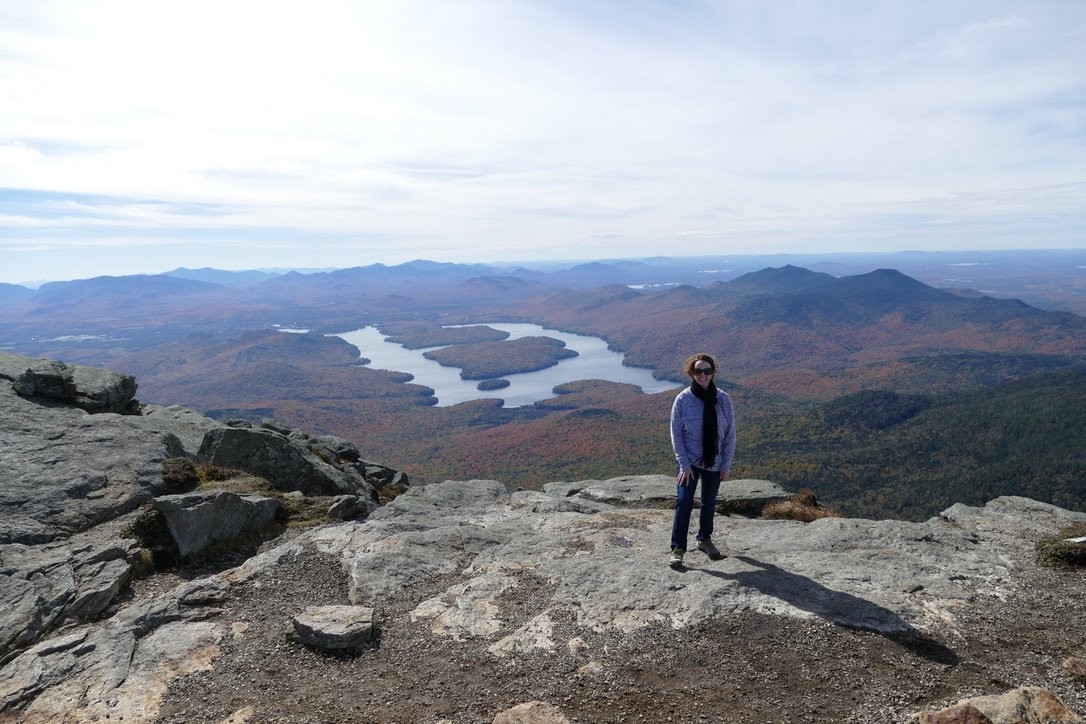 Upstate New York -  mountaintop with a panoramic view of lakes and mountains in the distance.