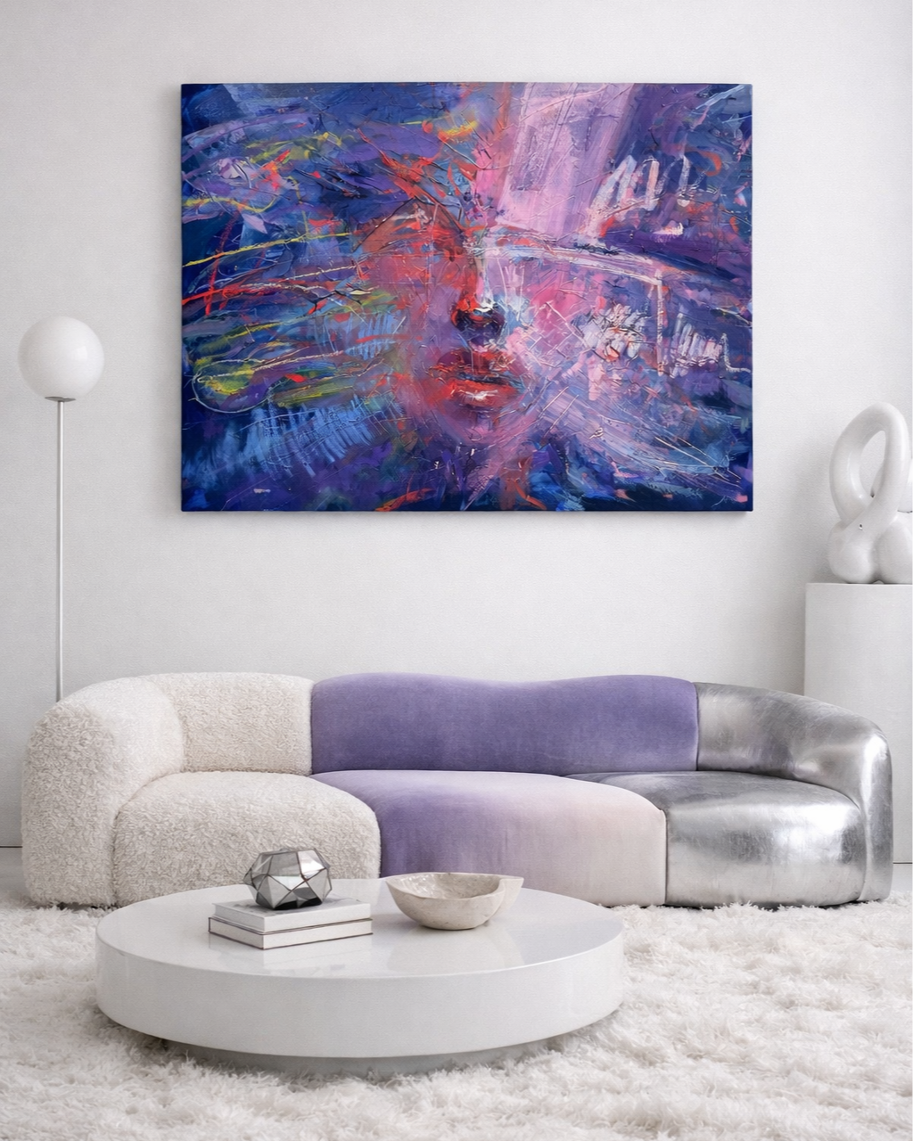 Modern living room with colorful abstract portrait painting, curved white and lavender sofa, round coffee table, and plush white rug