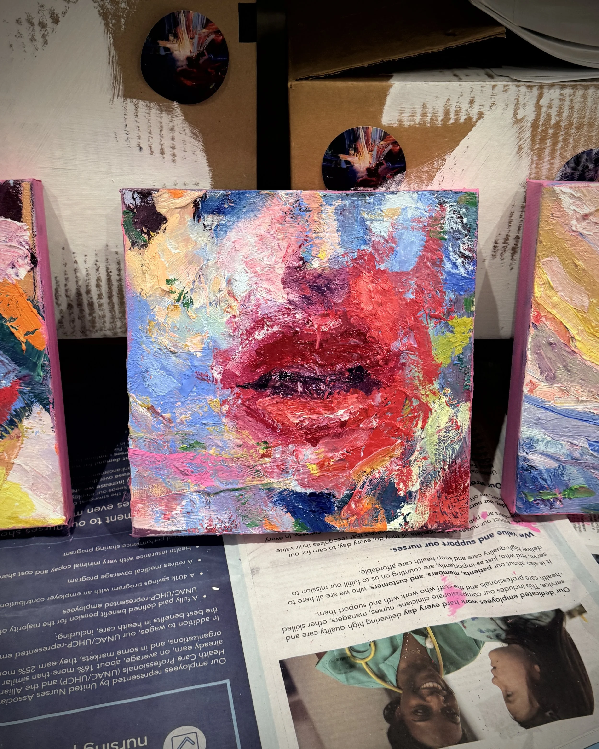 Original textured oil painting by contemporary artist Taia Akulova, featuring expressive red, pink, blue, and purple brushstrokes.