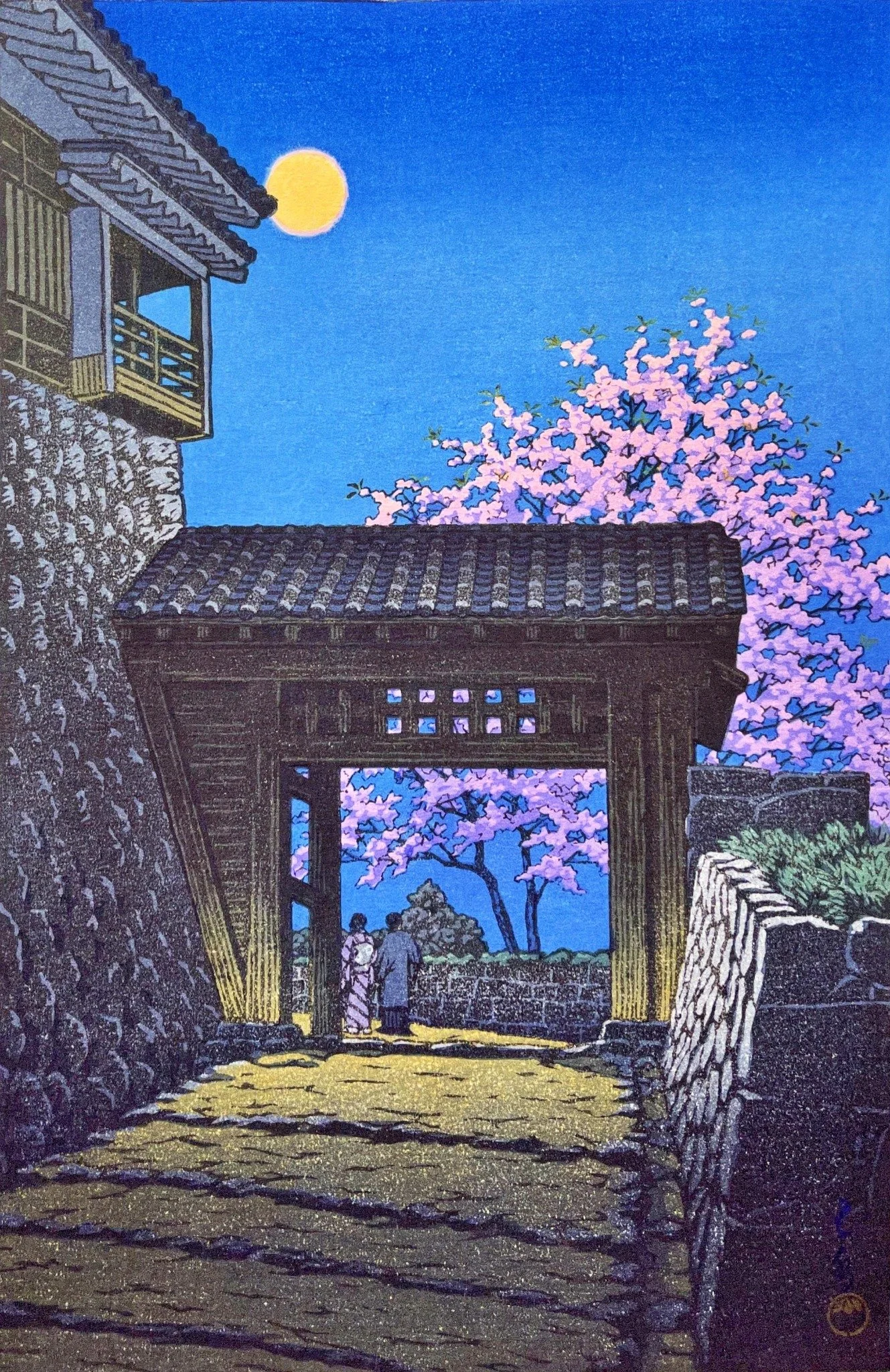 Full Moon over Matsuyama Castle by Kawase Hasui: a yellow moon above a dark wooden gate and tall stone walls, with pink cherry blossoms, two small figures and a blue evening sky.