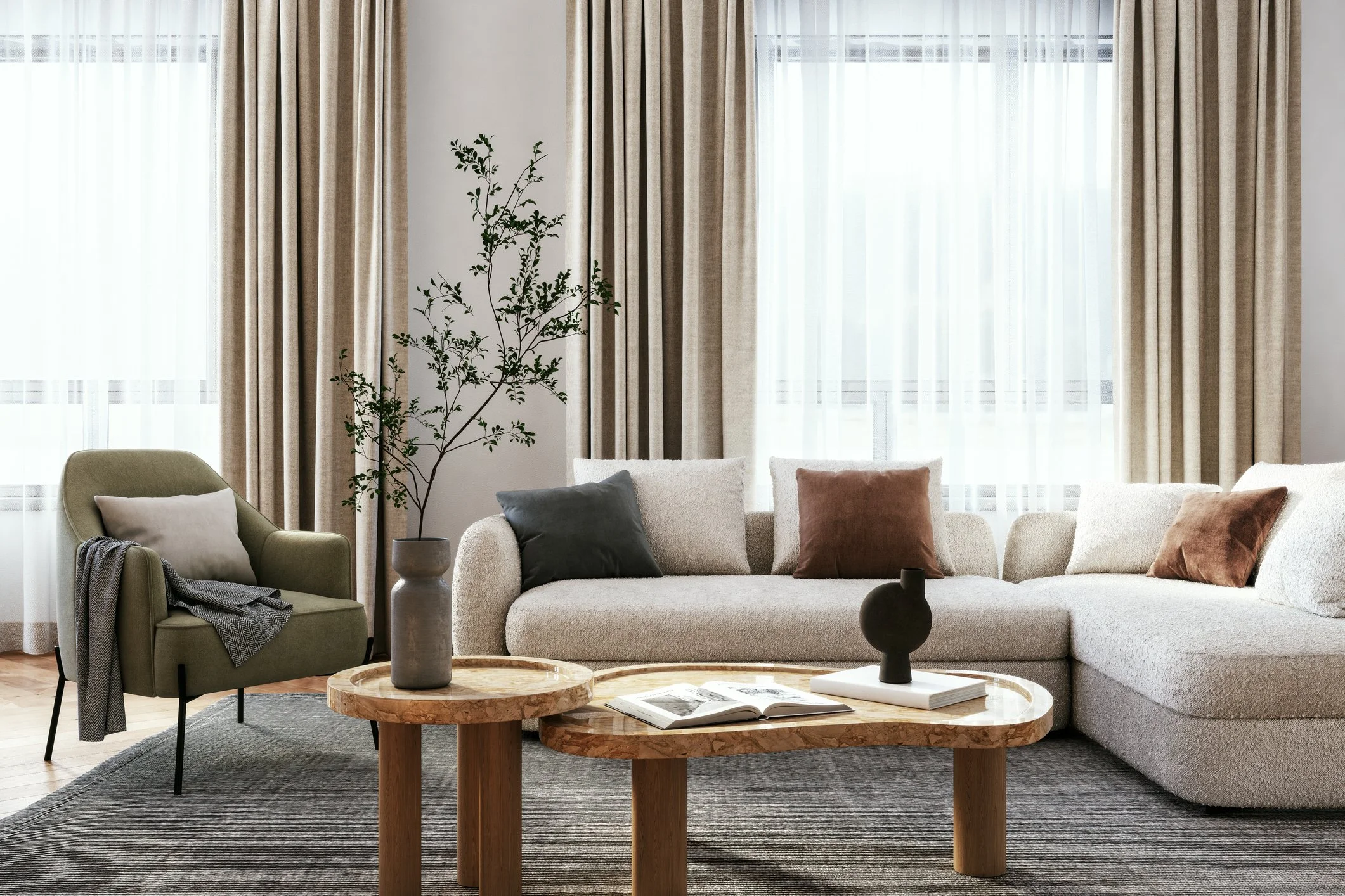 Living room with beige sofa, green armchair, round wooden coffee tables, decorative vases, and large windows with beige curtains.