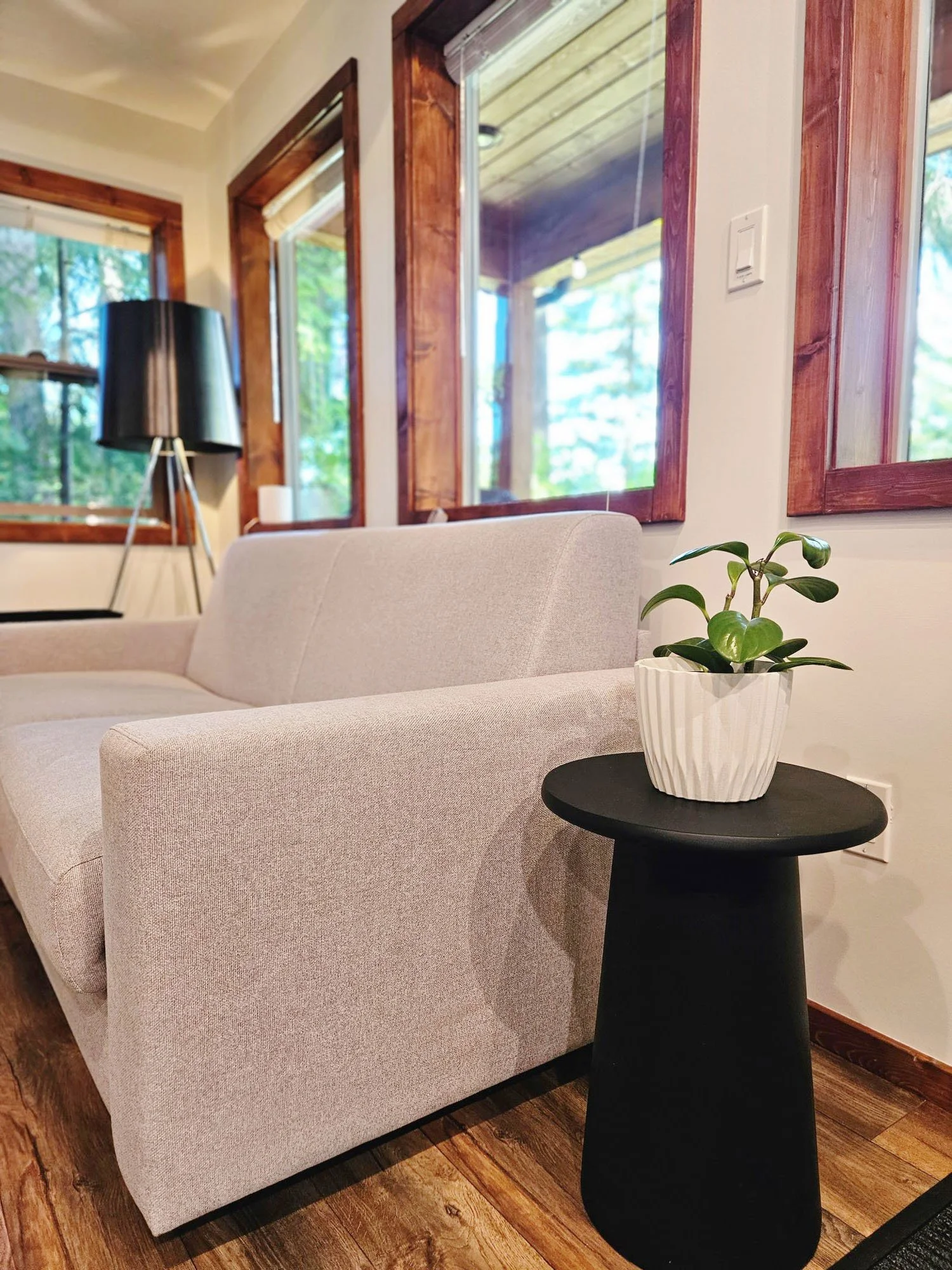 white sofa black side table