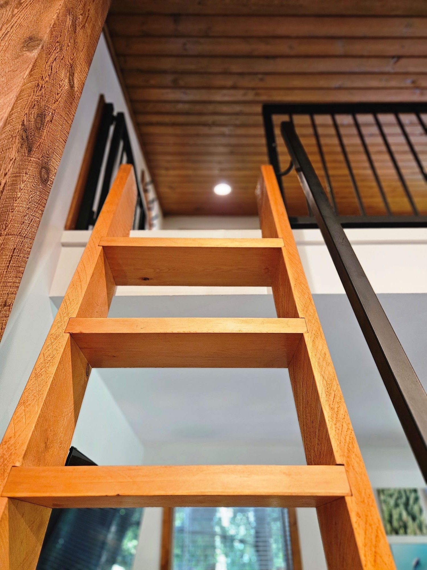 wood ladder to cabin loft