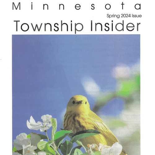 Cover of Minnesota Township Insider magazine, Spring 2024 issue, featuring a yellow bird perched on a branch with white flowers against a blurred blue sky background.
