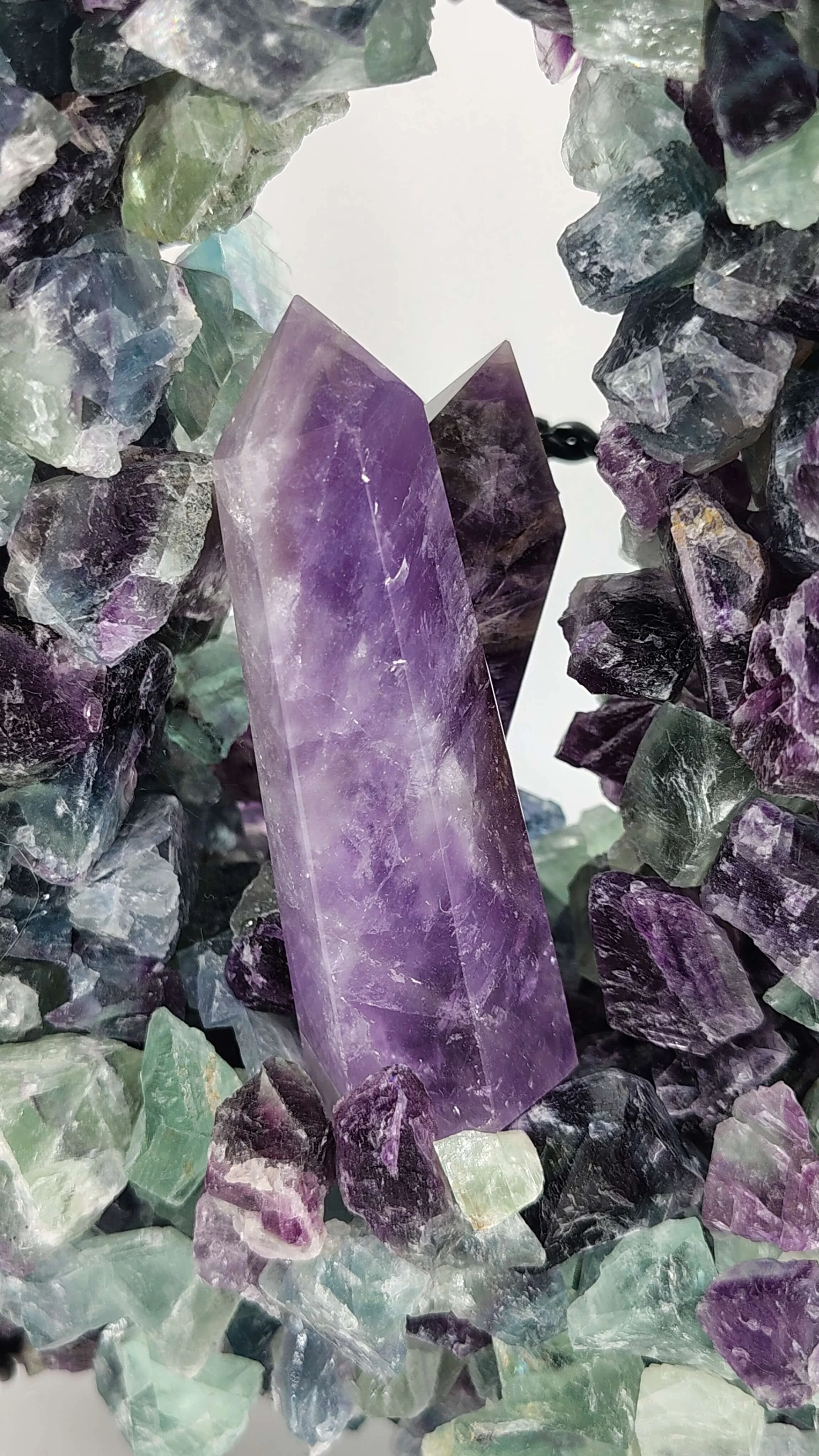 Amethyst framed in rainbow flourite 2 (1).jpg